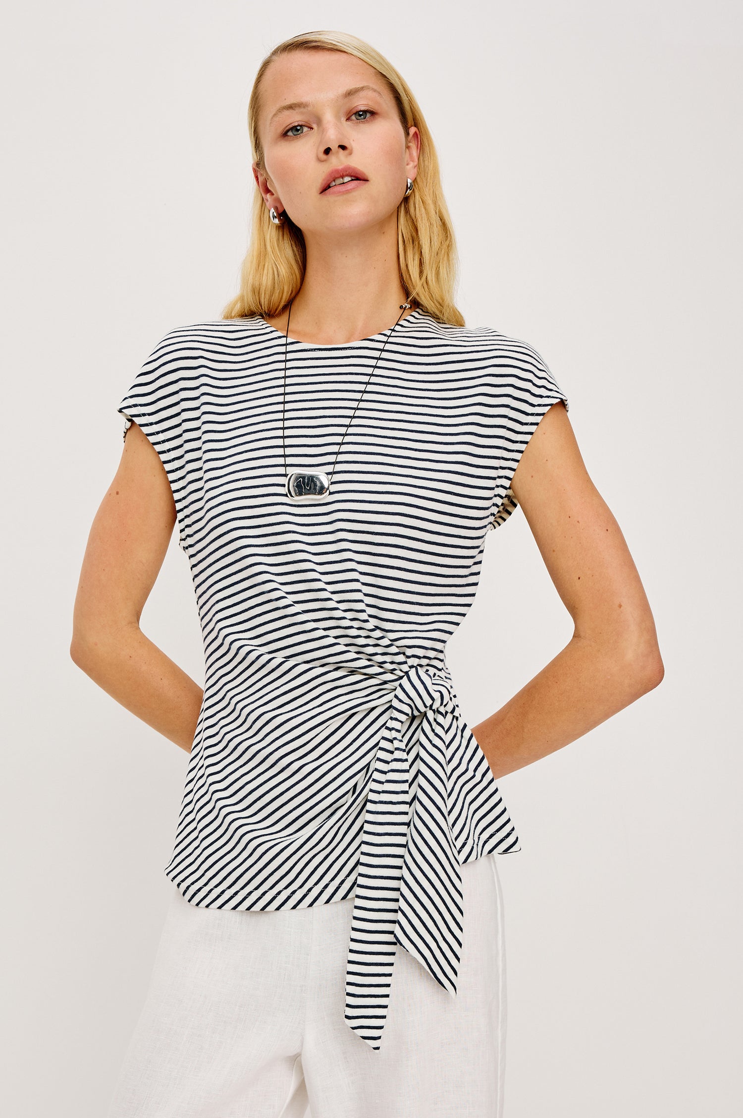 Gabbie Top in Cotton With Boat Neckline Dolman Cap Sleeves and Waist Wrap Ties in Ivory Navy Micro Stripe Colorway - Upper Body Close Up Front View Featured on Model