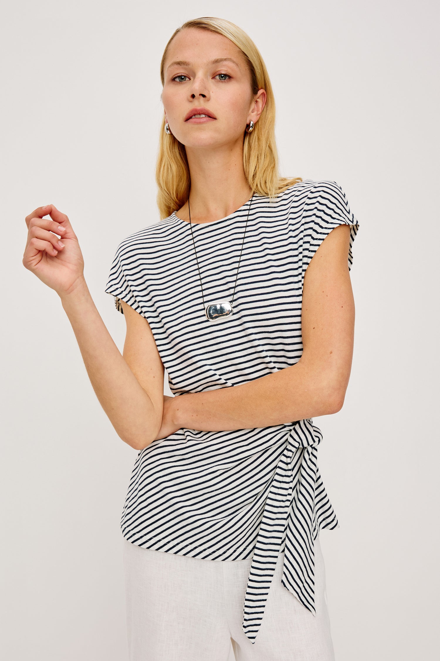 Gabbie Top in Cotton With Boat Neckline Dolman Cap Sleeves and Waist Wrap Ties in Ivory Navy Micro Stripe Colorway - Upper Body Front View Featured on Model