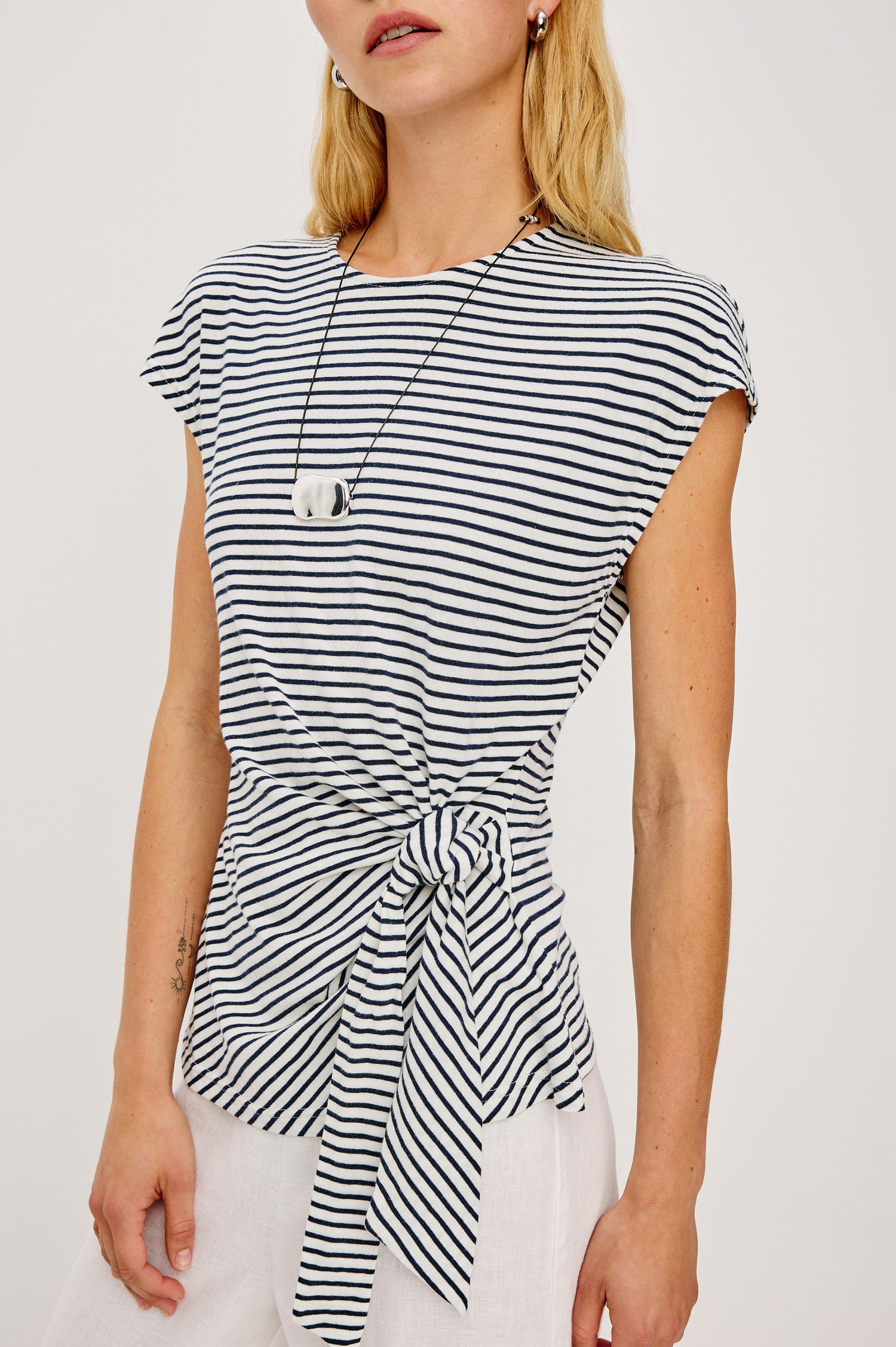 Gabbie Top in Cotton With Boat Neckline Dolman Cap Sleeves and Waist Wrap Ties in Ivory Navy Micro Stripe Colorway - Upper Body Close Up Front View Featured on Model