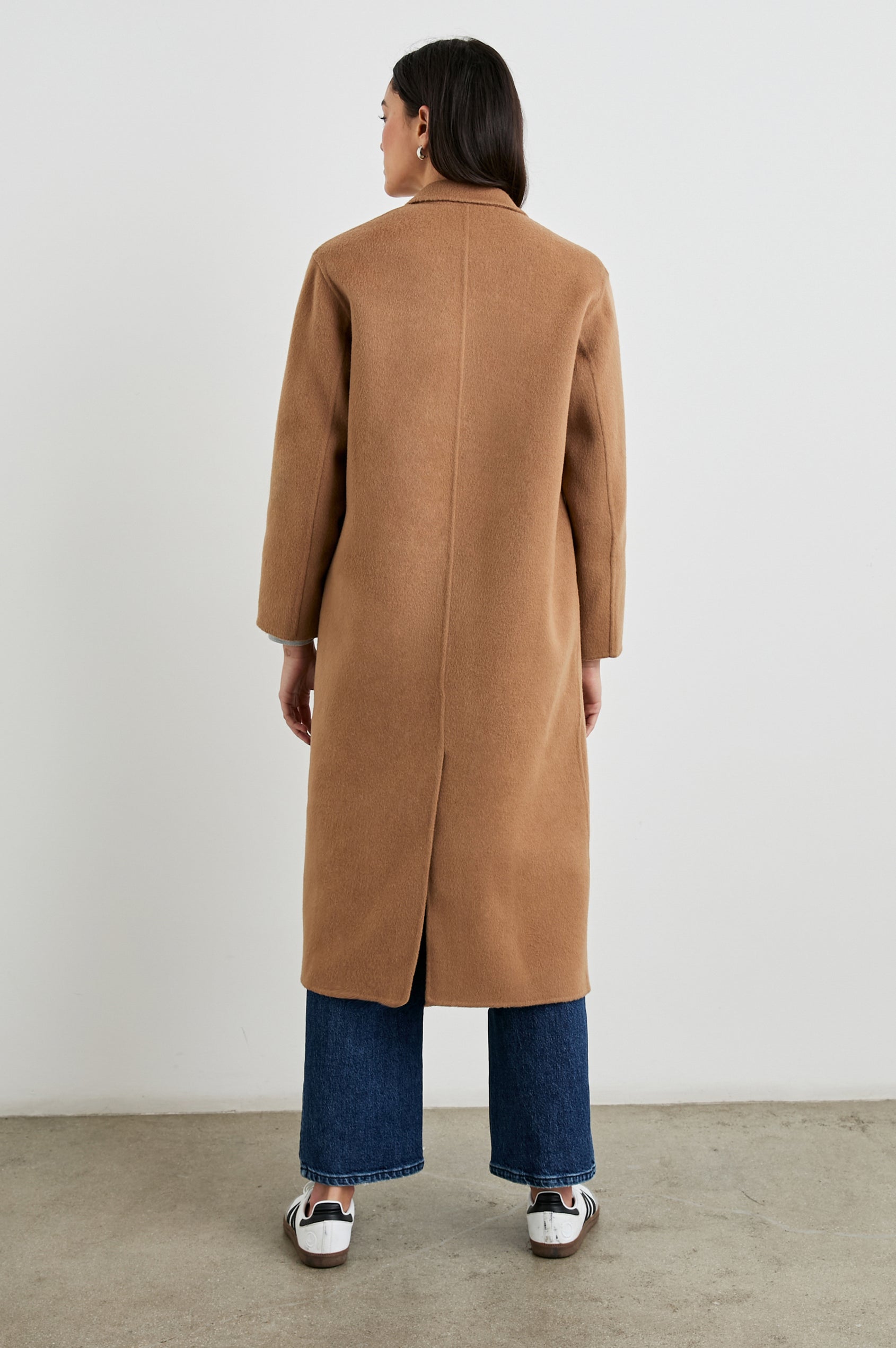 Gallery Below-the-Knee Coat with Three-Button Closure, Notched Lapels, and Two Front Flap Pockets in Camel Colorway - Back Full Body View Featured on Model