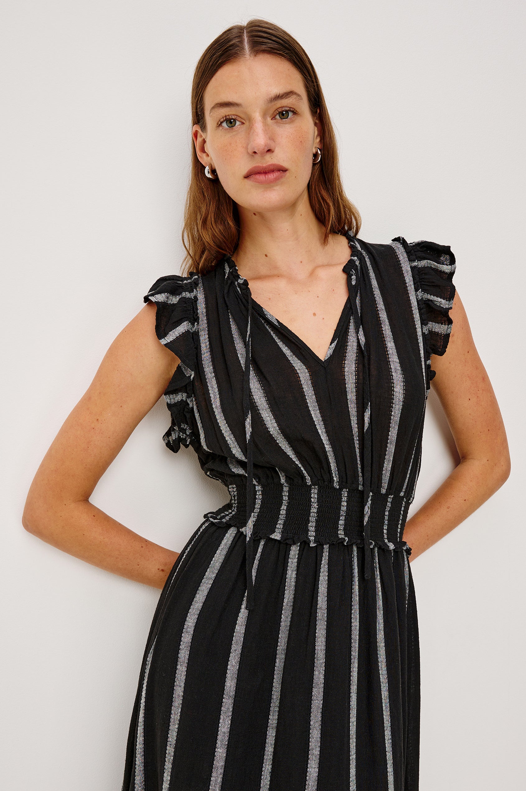 Garden Midi Dress with Flutter Cap Sleeves, Drawstrings at V-Neck and Shirred Waistband in Ash Leno Stripe Colorway, with Grey Vertical Stripes on Black - Close Up View Featured on Model