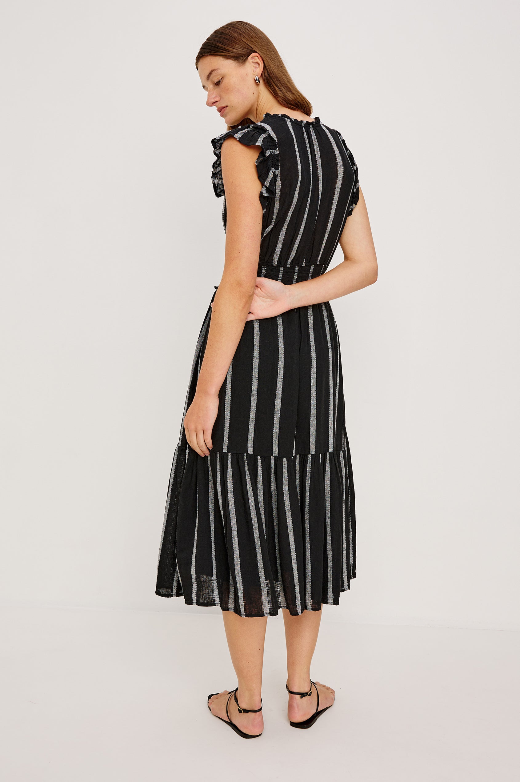 Garden Midi Dress with Flutter Cap Sleeves, Drawstrings at V-Neck and Shirred Waistband in Ash Leno Stripe Colorway, with Grey Vertical Stripes on Black - Back Full Body View Featured on Model