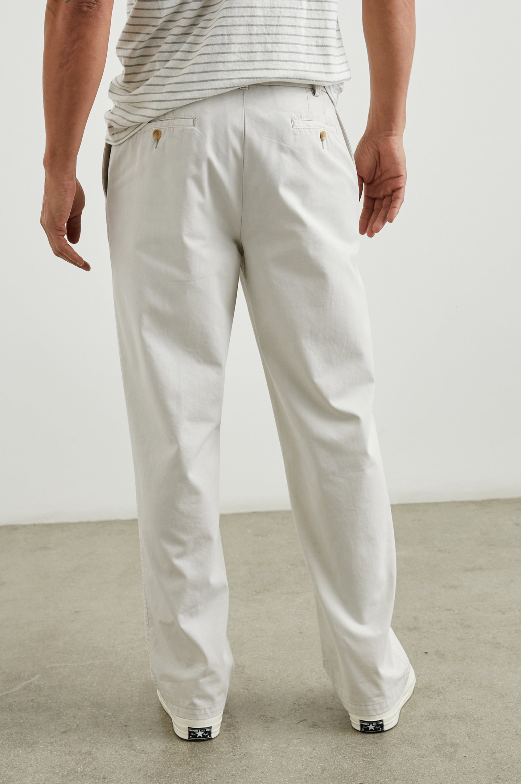 Garrett Pants with a Button Strap Closure at the Waist, Belt Loops, Two Front Pockets and Two Back Button Welt Pockets in Stone Colorway - Back View Featured on Model
