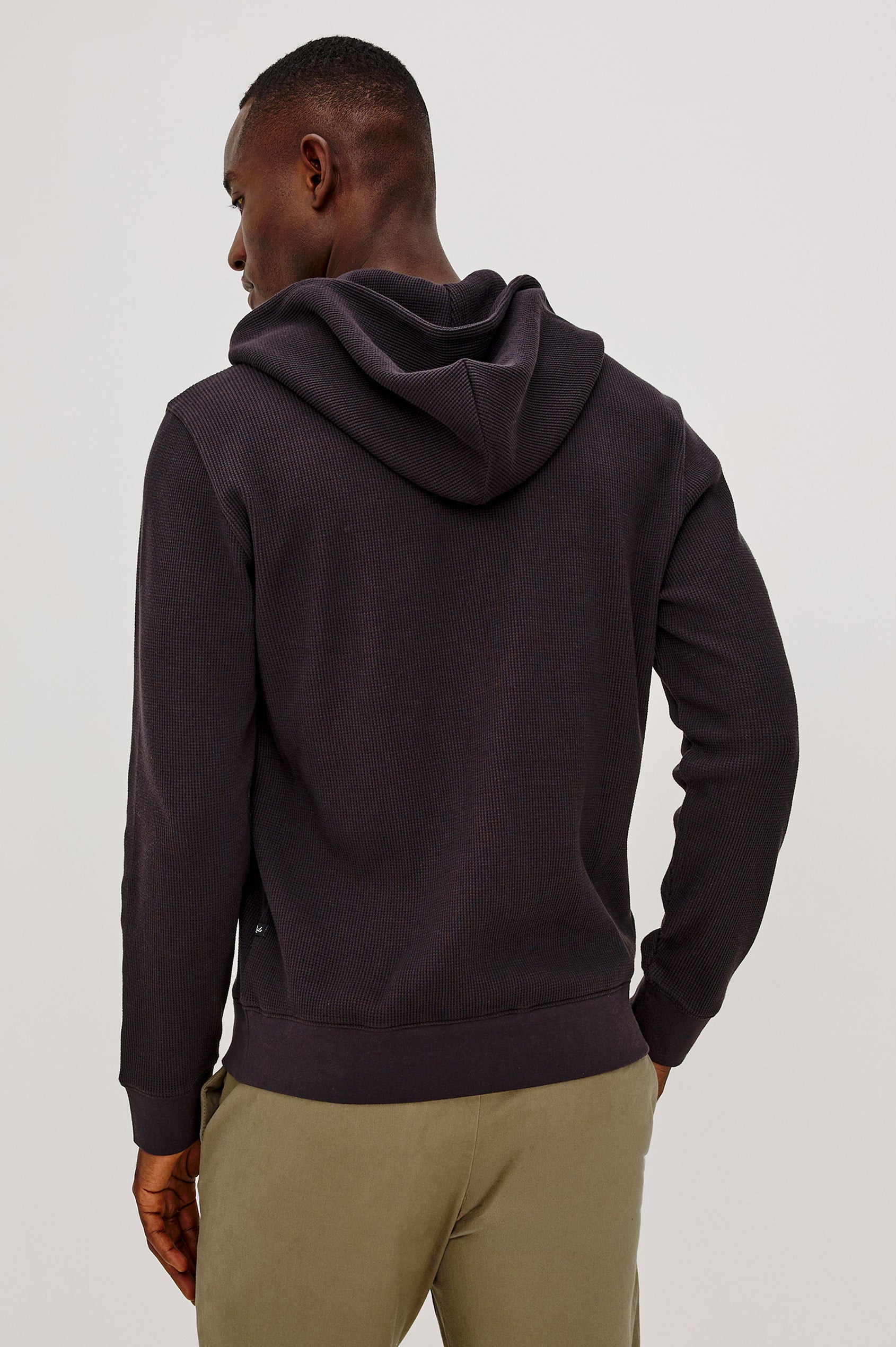 Gates Hoodie in Micro-Waffle Cotton Blend With Fixed Hood, Long Sleeves, and Relaxed Fit in Onyx Colorway - Upper Body Back View Featured on Model
