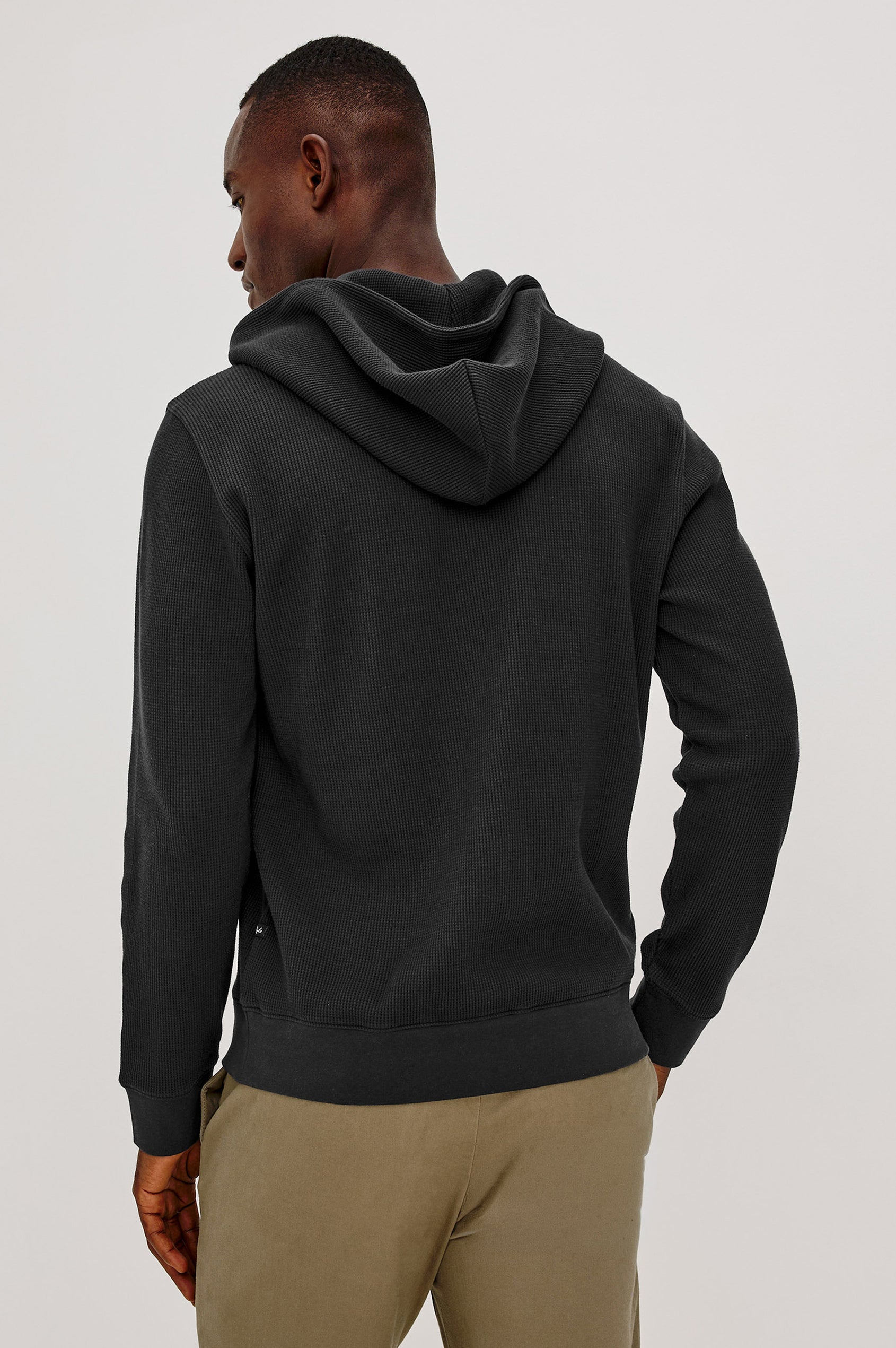 Gates Hoodie in Micro-Waffle Cotton Blend With Fixed Hood, Long Sleeves, and Relaxed Fit in Onyx Colorway - Upper Body Back View Featured on Model
