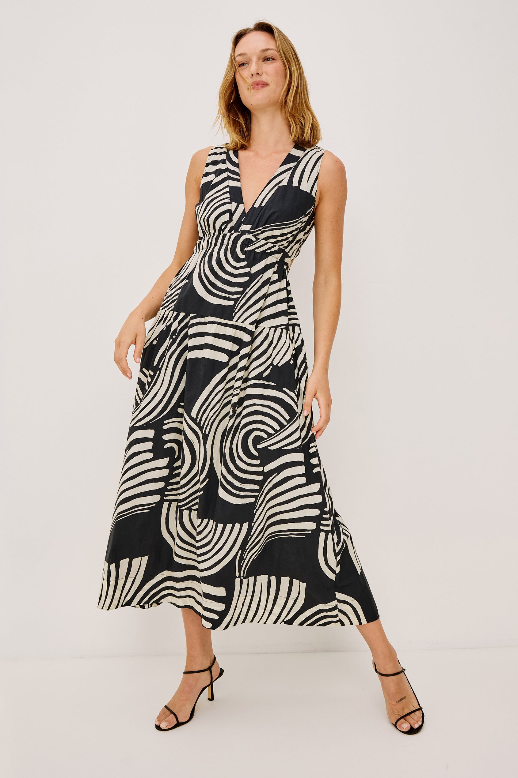Genevieve Maxi Dress in Cotton Voile With A-Line Silhouette, V-Neckline, Wide Elastic Underbust, Back Cutout, Full Lining, and Side Pockets in Onyx Waves Colorway - Full Body Front View Featured on Model