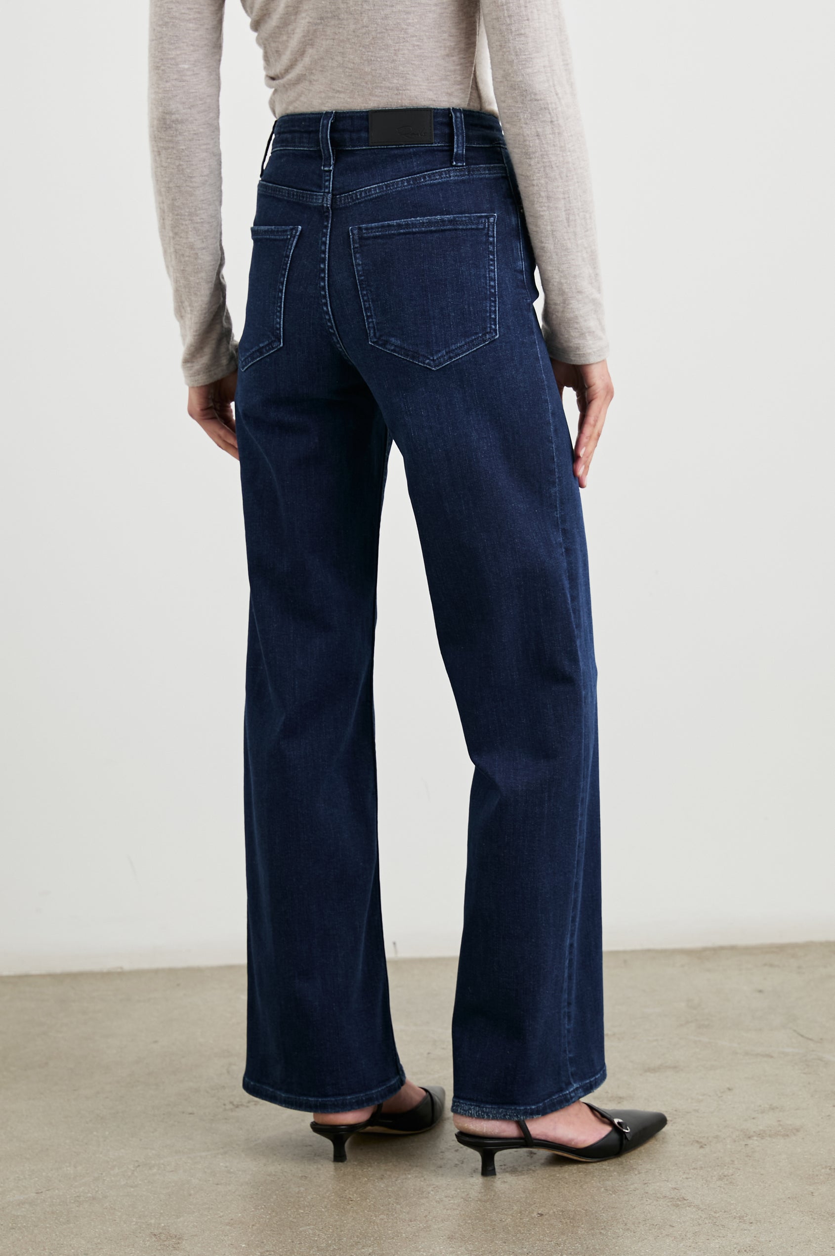 Getty Wide Leg Denim Pants with Belt Loops, Two Front Pockets and Two Back Patch Pockets in After Midnight Colorway - Back View Featured on Model