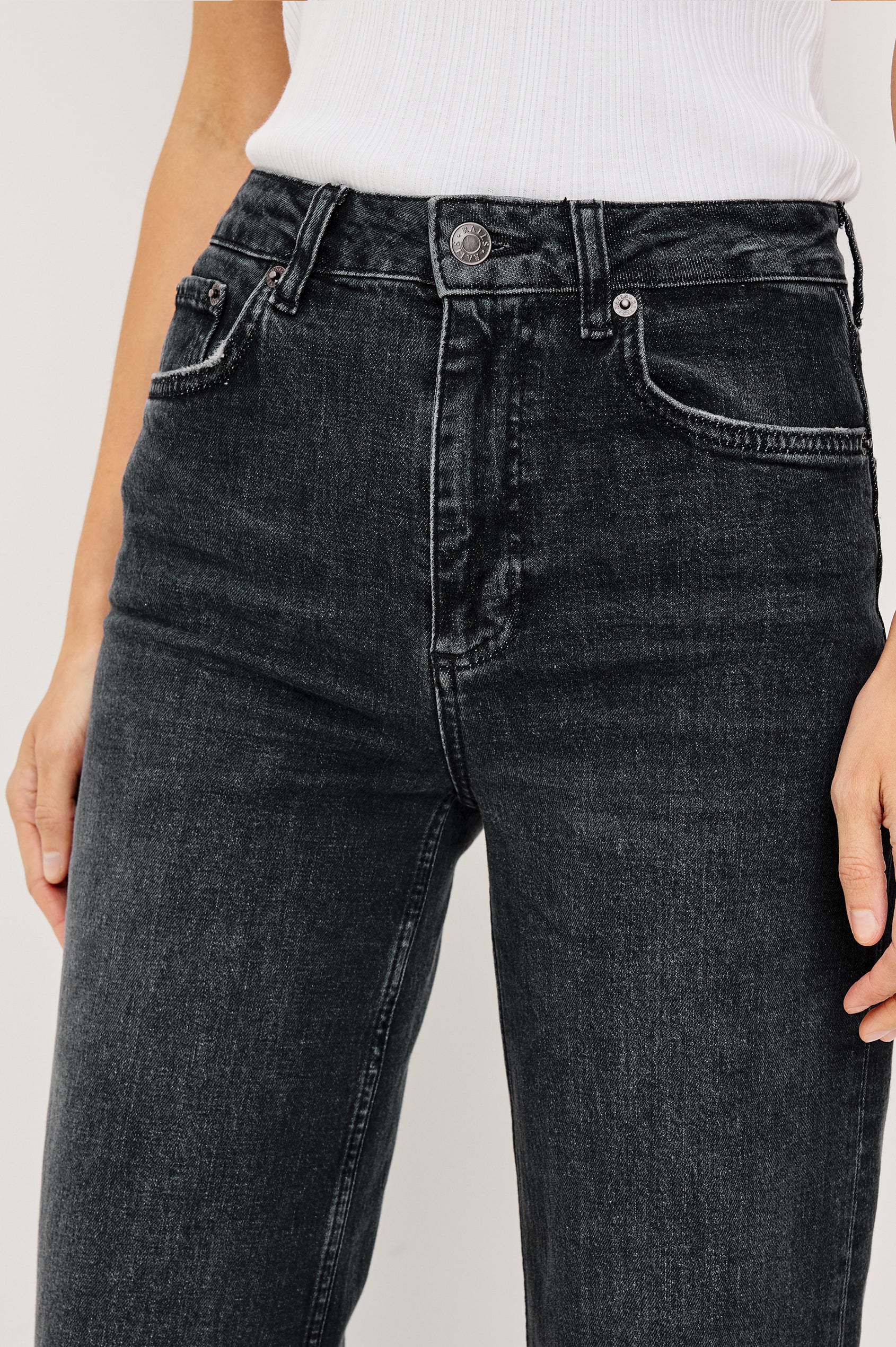 Getty Wide Leg Jean in Dark Wash Denim With High-Rise High-Waisted Fit, Front Button Fly, 5-Pocket Styling in Black Pearl Colorway - Lower Body Front Close Up View Featured on Model