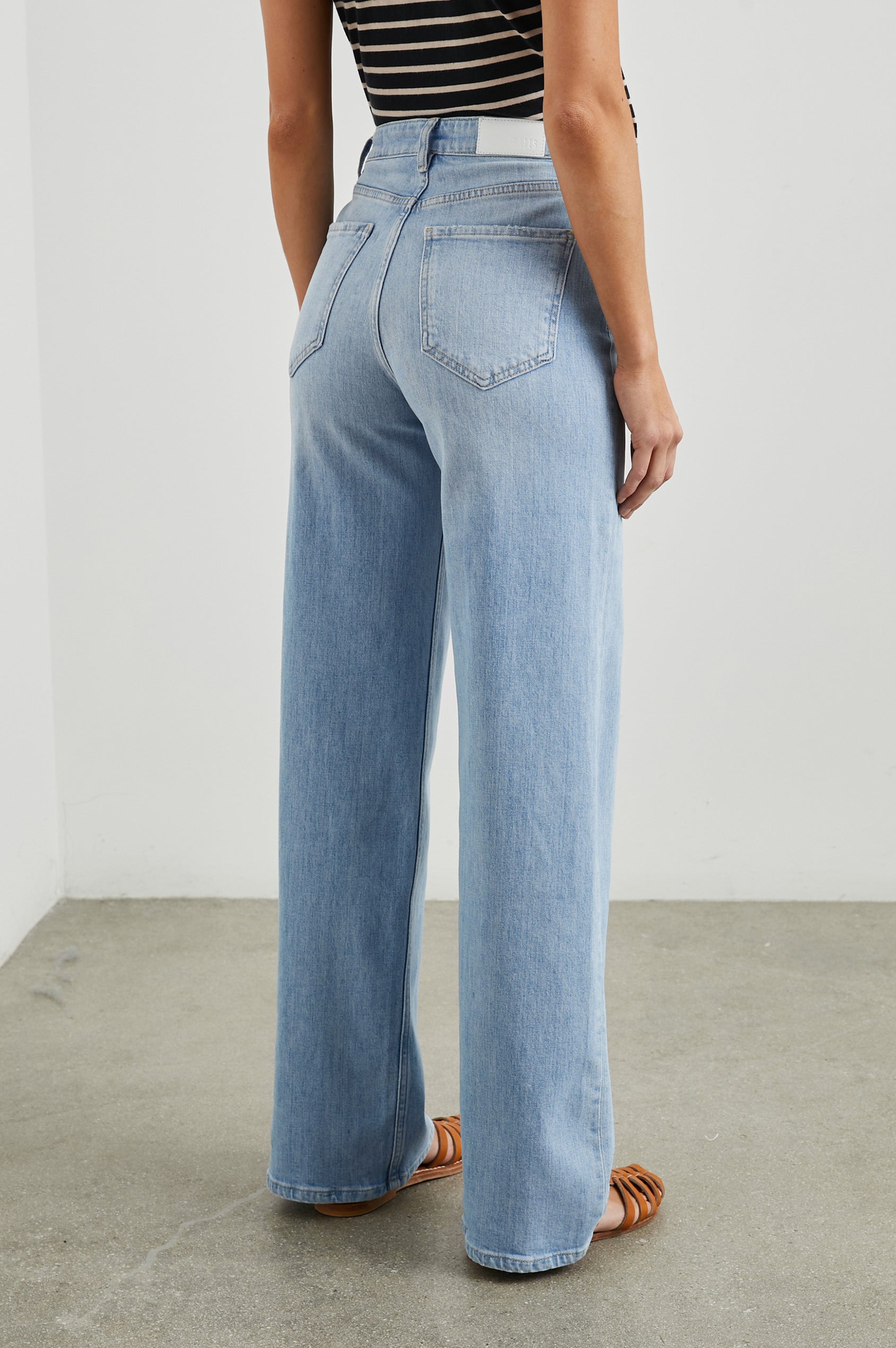 Getty Wide Leg Denim Pants with Belt Loops, Two Front Pockets and Two Back Patch Pockets in Blue Mist Colorway - Back View Featured on Model