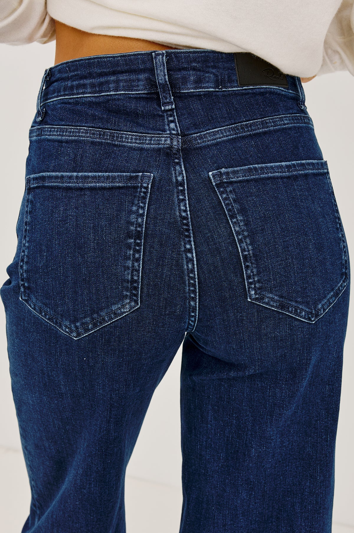 Getty Crop Wide Leg Jean in Light Stretch Denim With High-Rise High-Waisted Fit, Button Fly, and 5-Pockets in After Midnight Colorway - Upper Body Front Detail View Featured on Model.