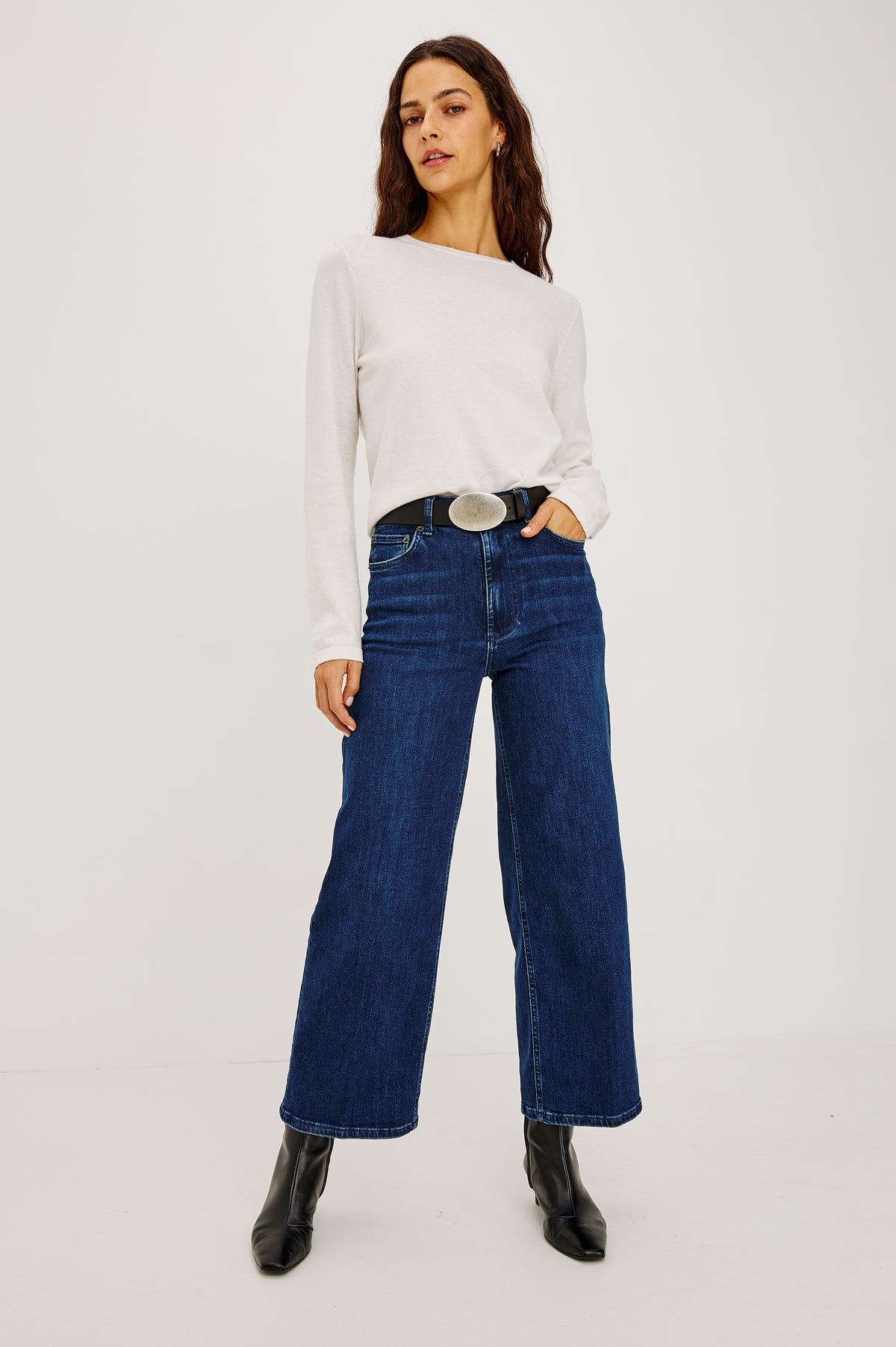 Getty Crop Wide Leg Jean in Light Stretch Denim With High-Rise High-Waisted Fit, Button Fly, and 5-Pockets in After Midnight Colorway - Full Body Front View Featured on Model.