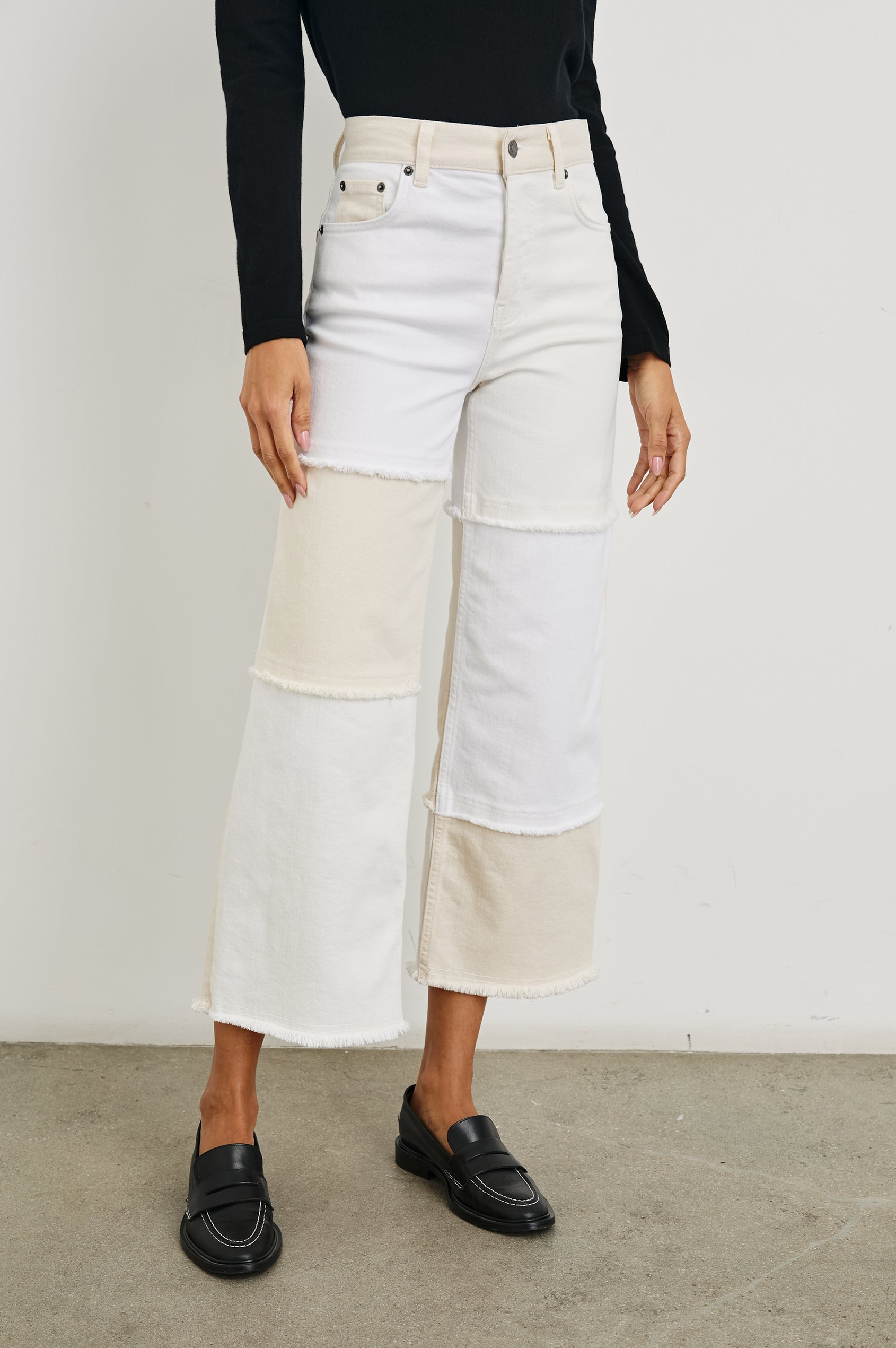 Getty Crop Wide Leg Denim Pants with Belt Loops, Two Front Pockets and Two Back Patch Pockets in Ecru Patchwork Colorway, with large patches in shades of white - Front View Featured on Model