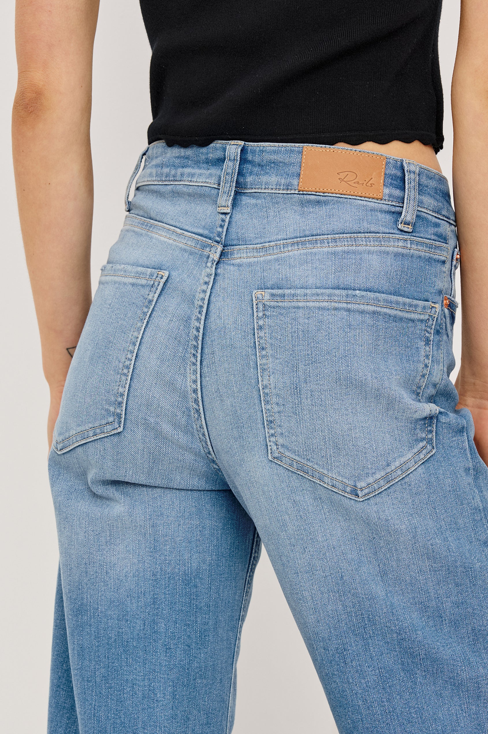 Getty crop isa a 5-pkt wide leg jean in Independence colorway, a medium wash with a released hem - close up back view featured on model.