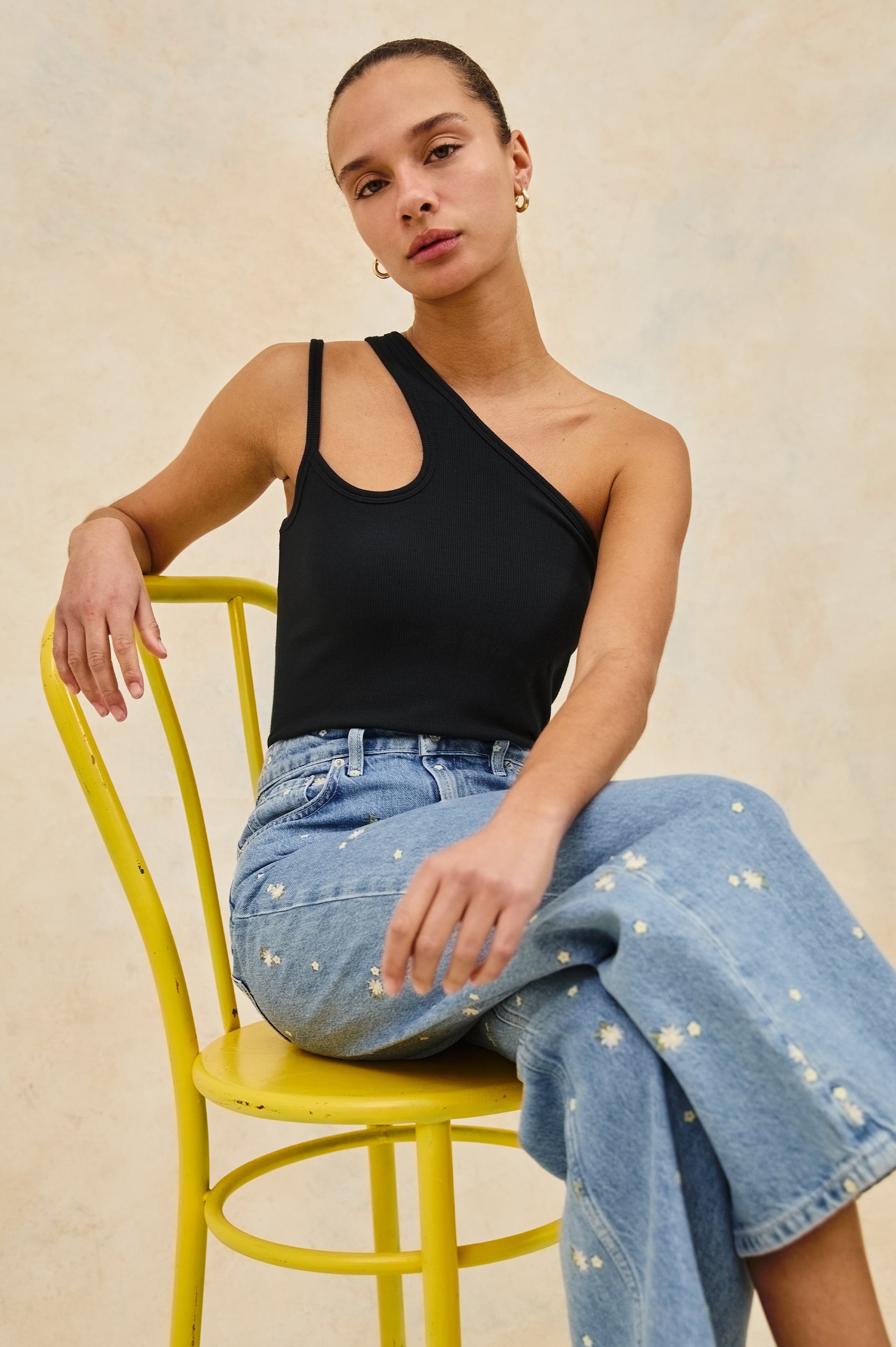 Getty cropped wide leg jean with Indigo Floral detailed embroidery - stylized view on model, sitting in chair