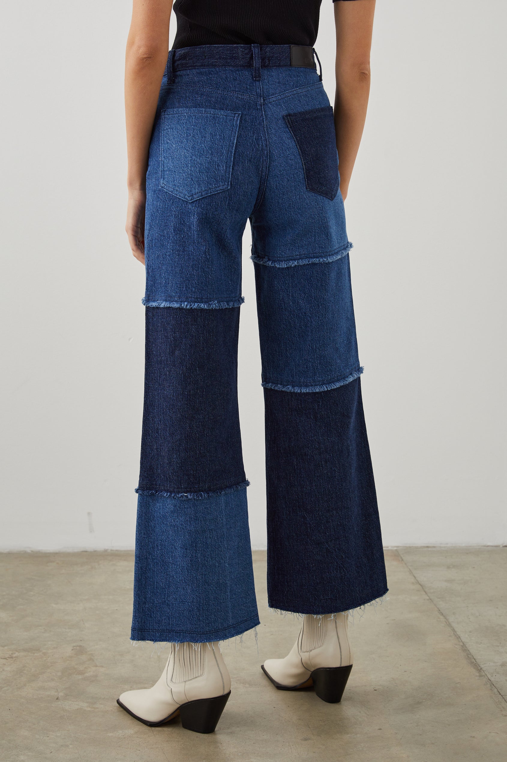 Getty Crop Wide Leg Denim Pants with Belt Loops, Two Front Pockets and Two Back Patch Pockets in Indigo Patchwork Colorway, with large patches in blues - Back View Featured on Model