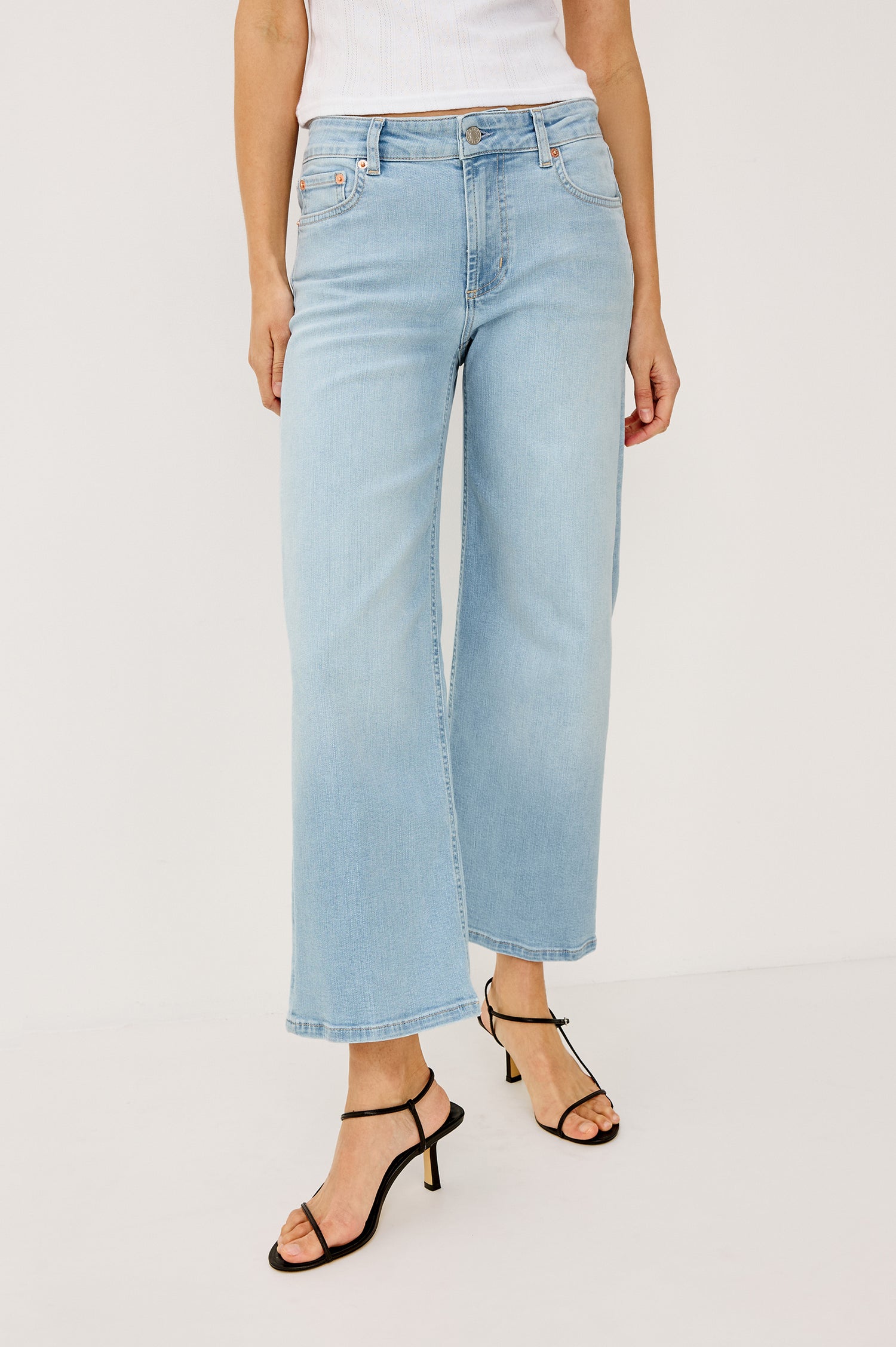 Getty Crop Low Rise Wide Straight Leg Jean in High Stretch Cotton Denim With 27" Inseam, Zip Fly, and 5-Pockets in Seaport Colorway - Lower Body Front View Featured on Model