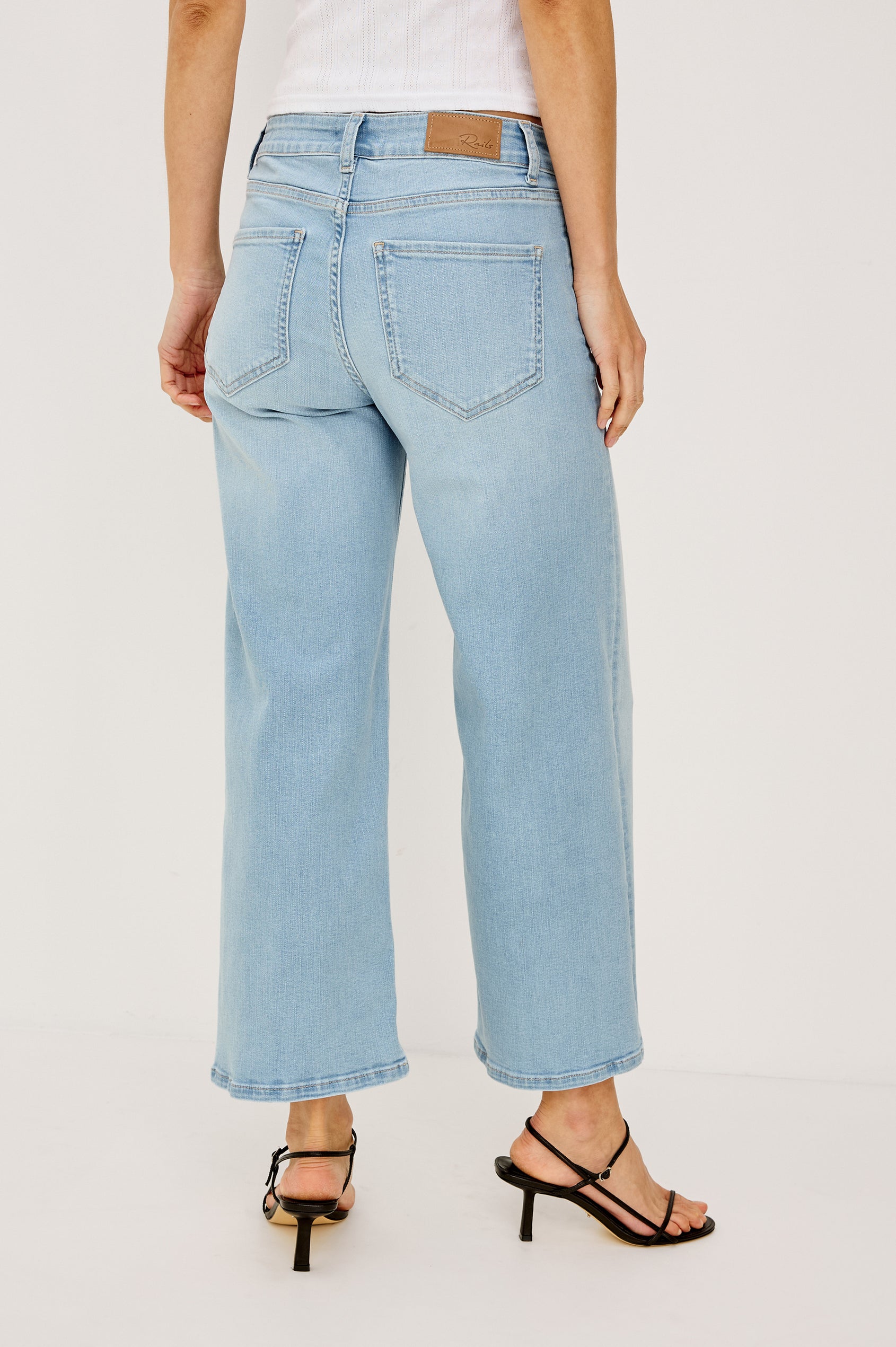 Getty Crop Low Rise Wide Straight Leg Jean in High Stretch Cotton Denim With 27" Inseam, Zip Fly, and 5-Pockets in Seaport Colorway - Lower Body Back View Featured on Model