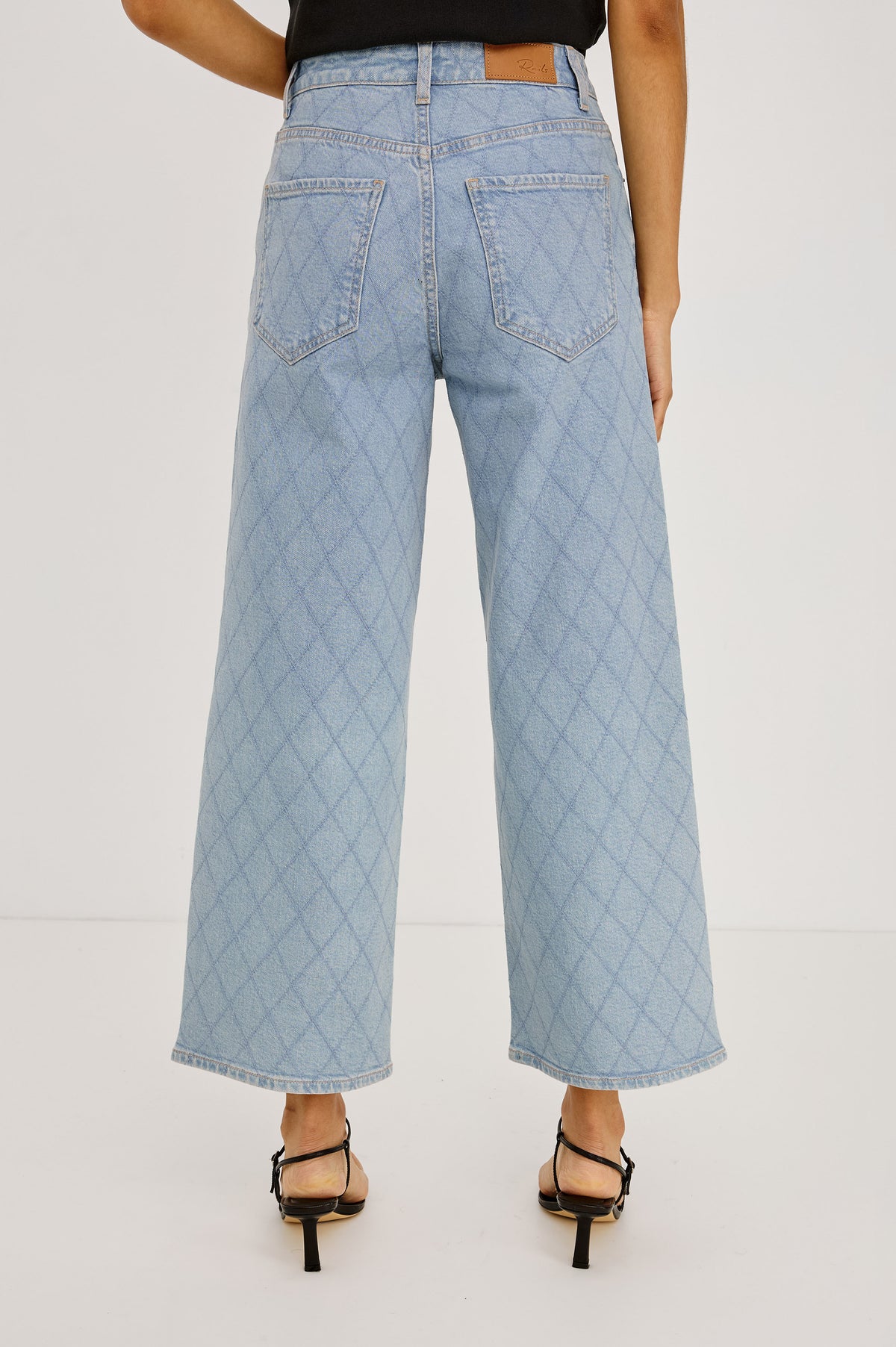 Getty Crop Wide Leg Jean in High-Stretch Denim With High-Rise, Wide Straight Leg Fit, 5-Pockets, and Zip Fly in Quilted Stud Colorway - Lower Body Back View Featured on Model