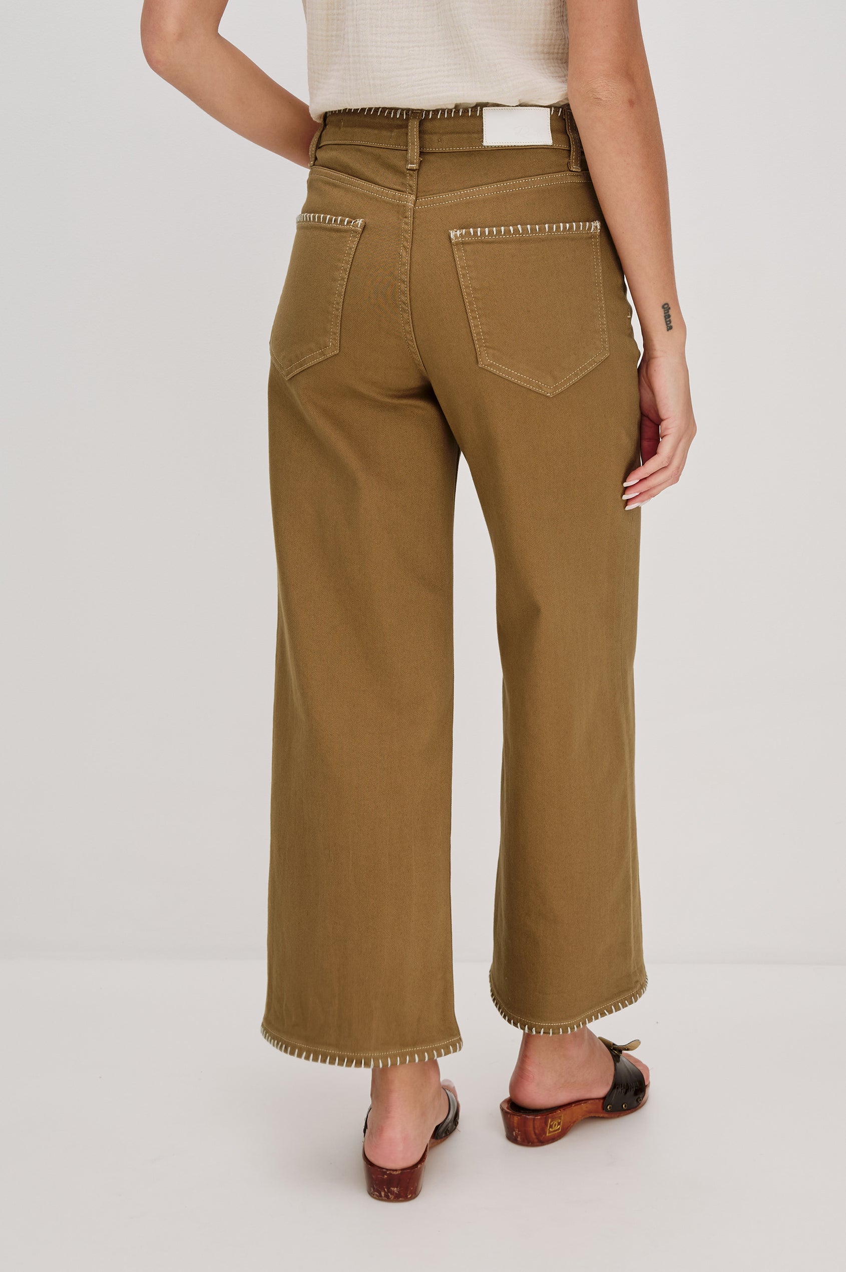 Getty cropped wide leg jean with contrast white blanket stitching in Safari Embroidered Colorway. Back View of Model Shown.
