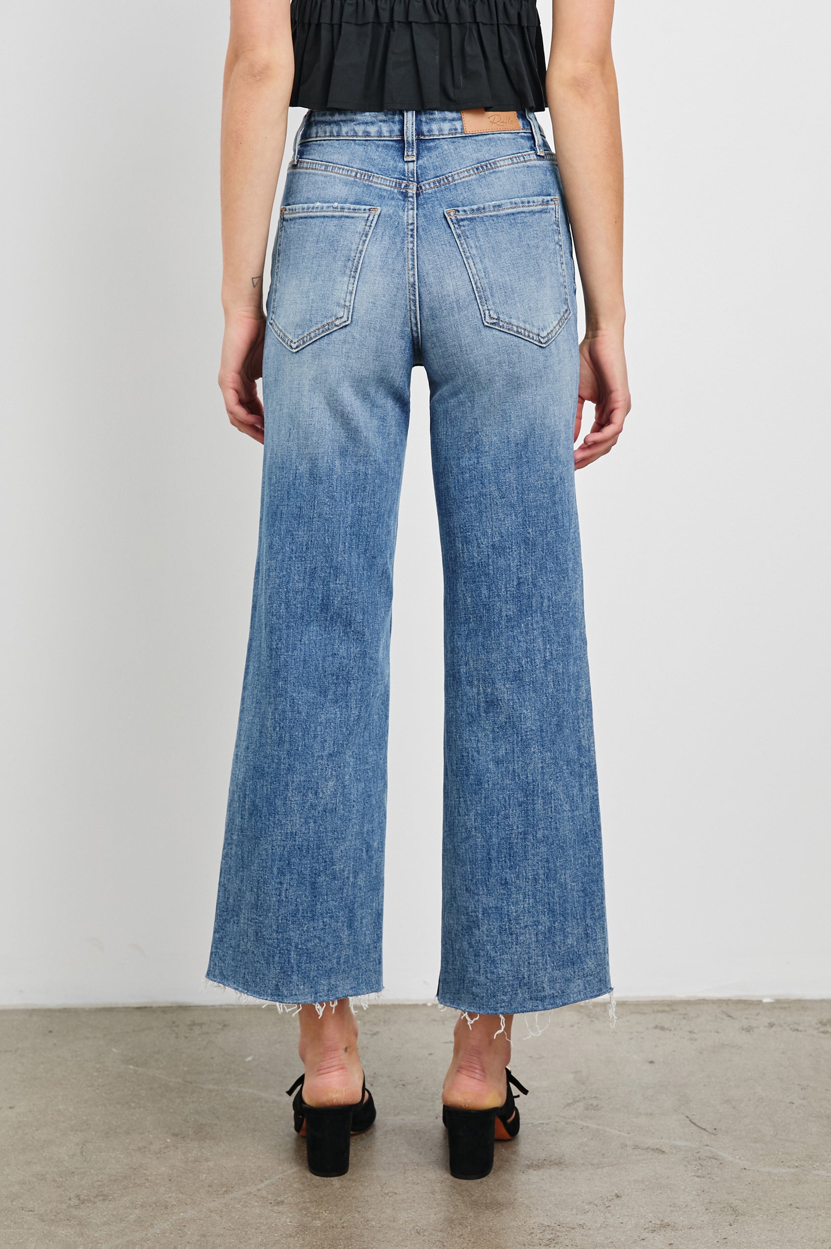 Getty cropped 5-pocket wide leg jean with in Tradewind, a medium wash. Back view featured on model.