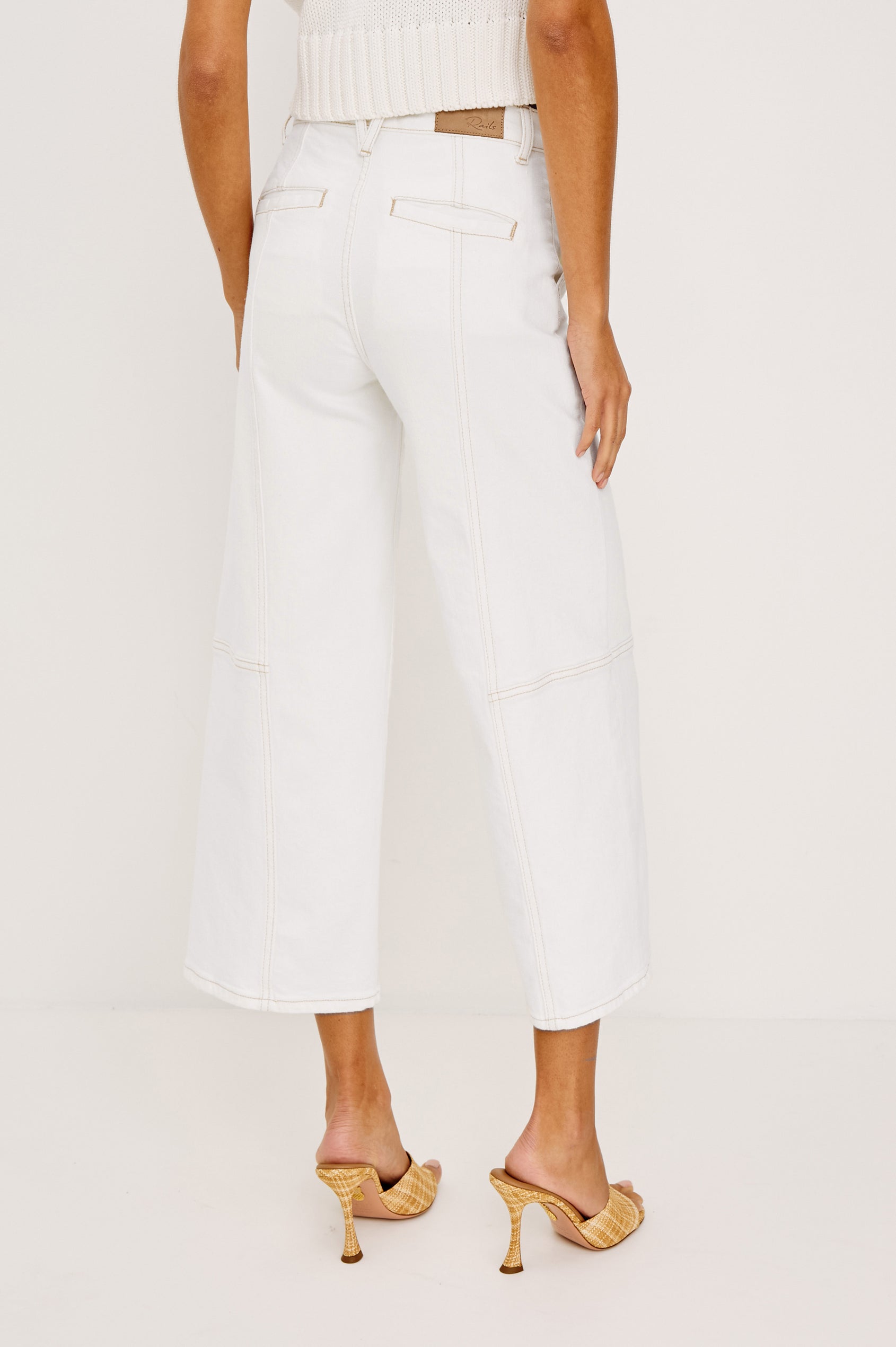 Getty Crop Utility Wide Leg Denim Pants with Belt Loops, Additional Seams, Two large Front Pockets and Two Back Patch Pockets in Vintage Ecru Contrast Stitch Colorway, gold-toned Seam Stitching - Back View Featured on Model