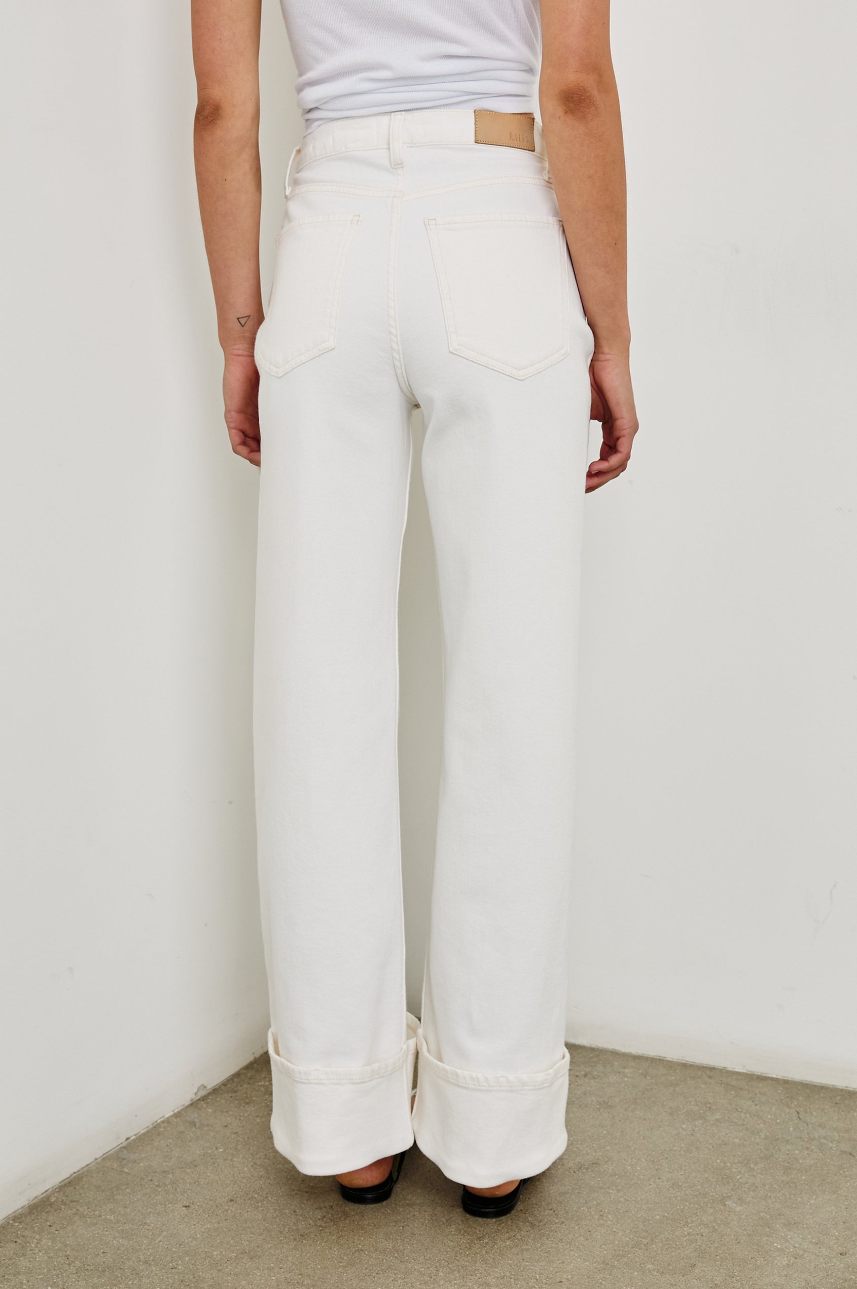 Getty high rise flared jean with long inseam and cuffed bottom details in Ecru Cuffed - back view on model