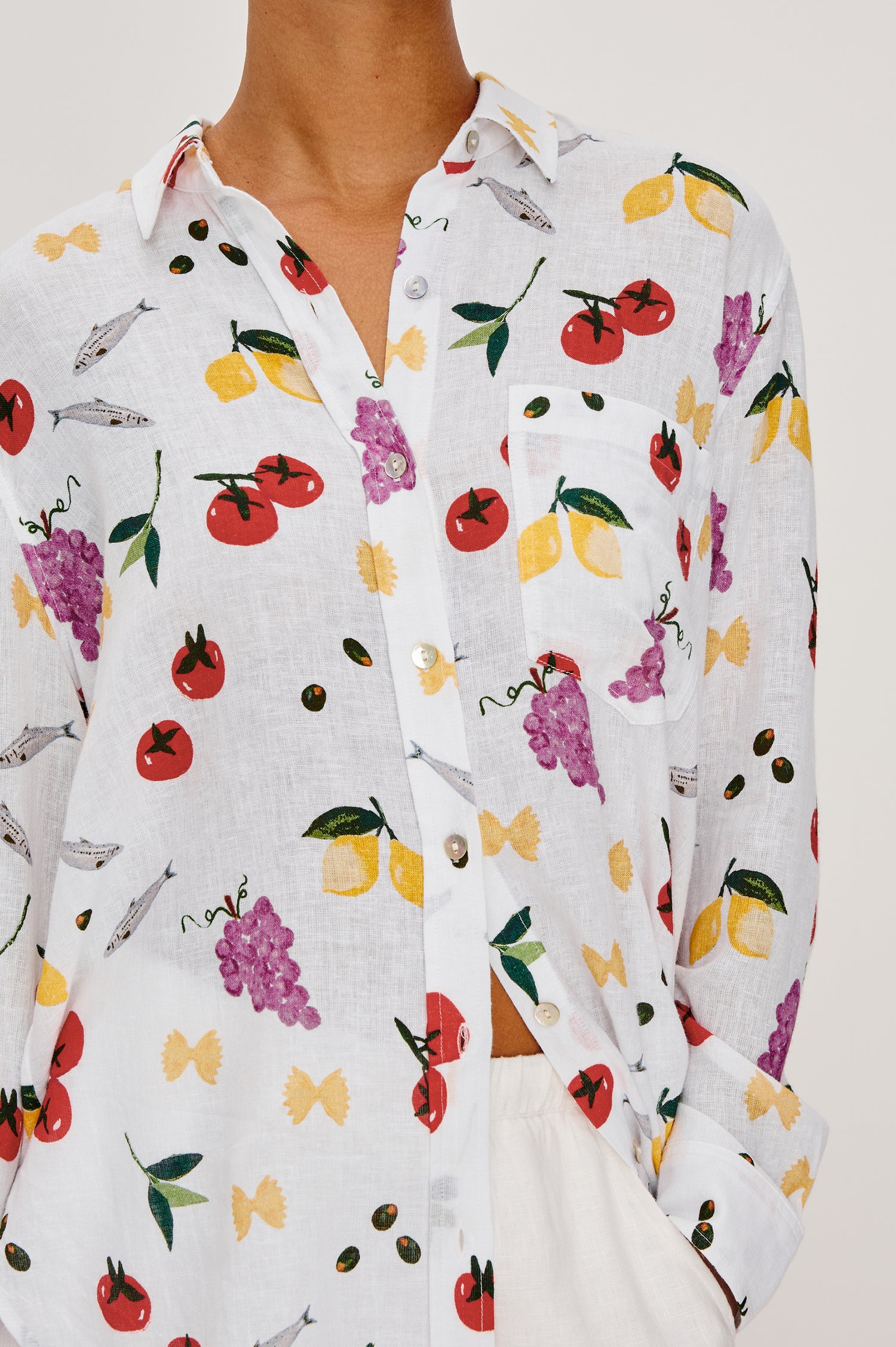 Giada lightweight linen button up shirt in Dinner Party colorway featuring Italian inspired sketches - Close up of details on model