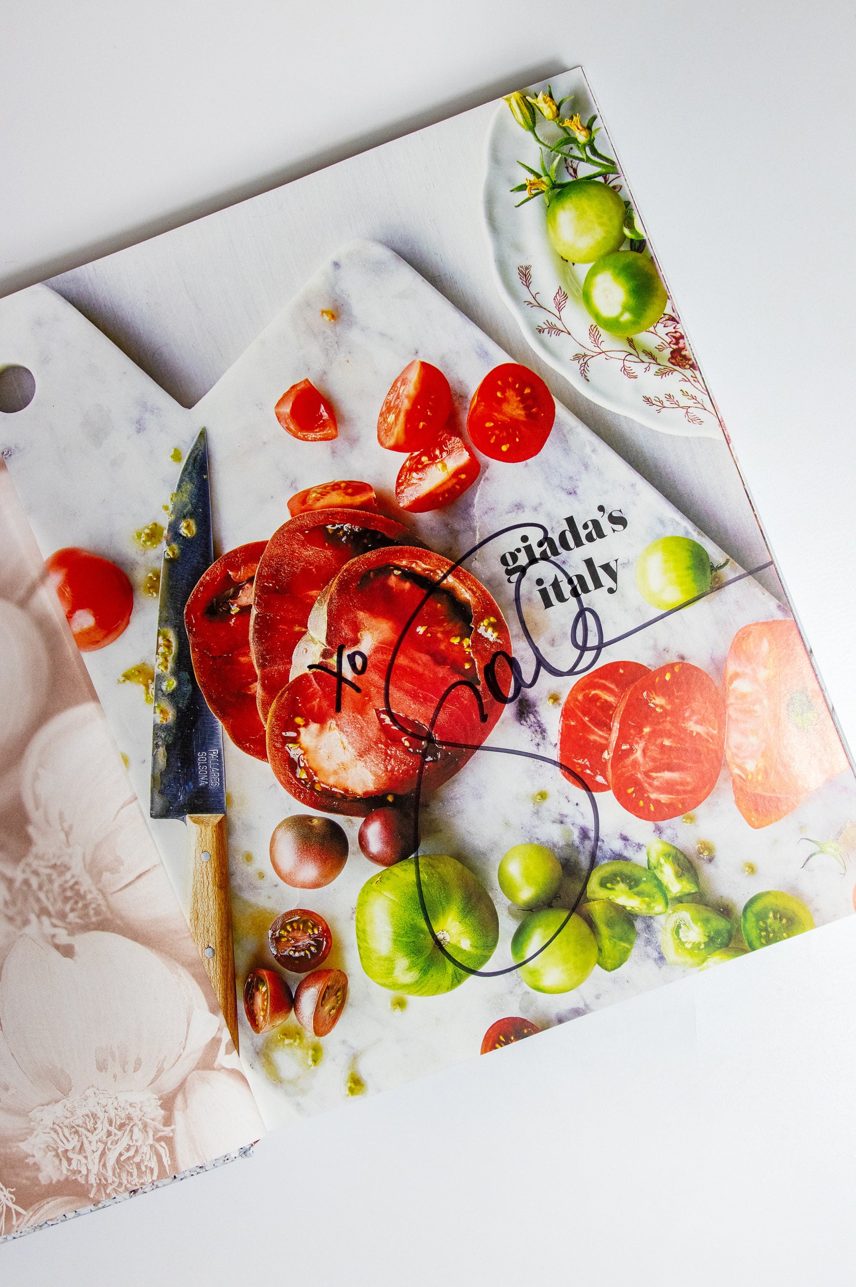 Giada's Italy hardcover book, display of signed page