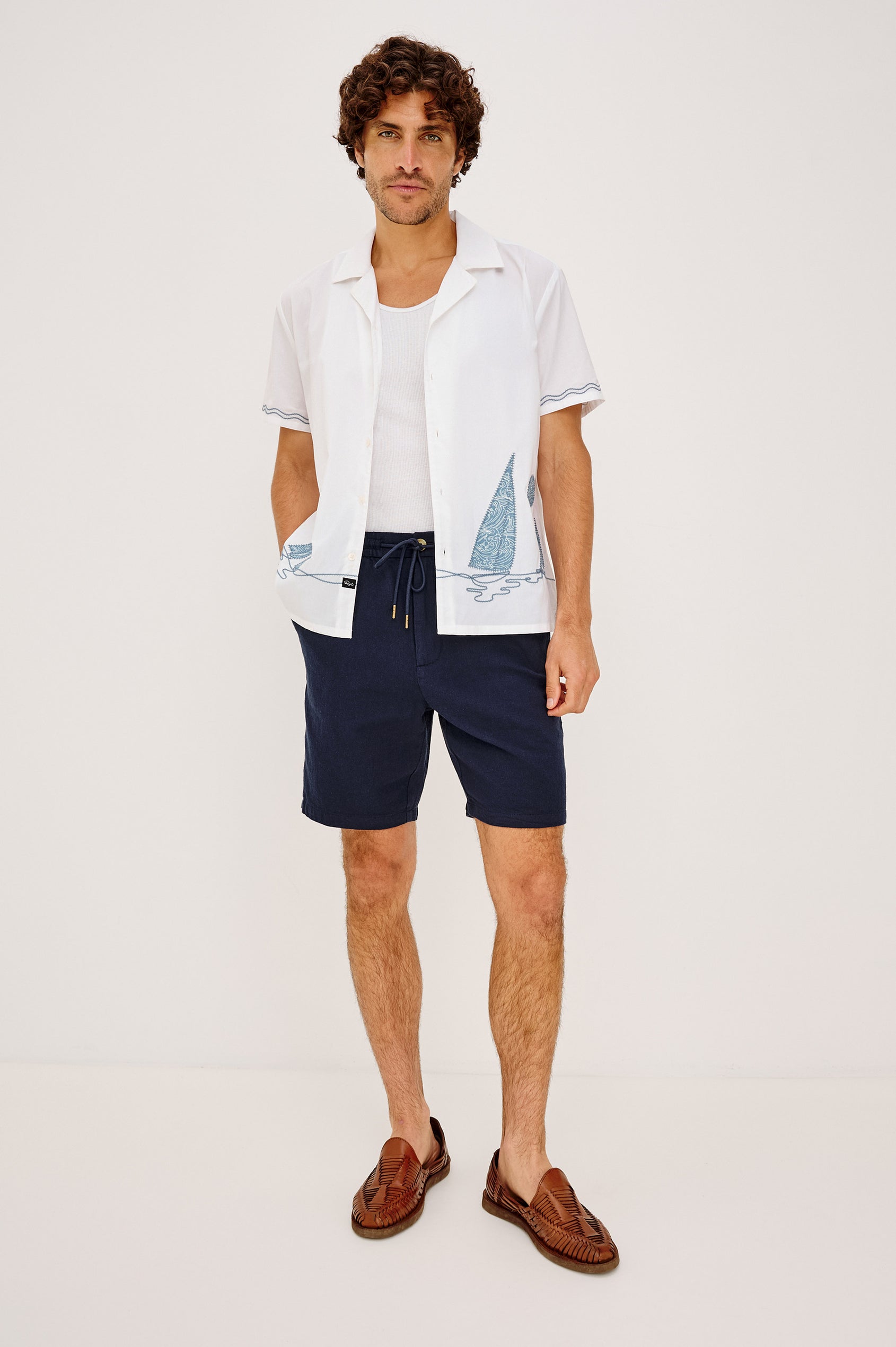 Gibson Camp Shirt in Linen-Cotton Dobby With Open Collar, Front Buttons, Short Sleeves, and Relaxed Fit in White Sail Horizon Colorway - Full Body Front View Featured on Model