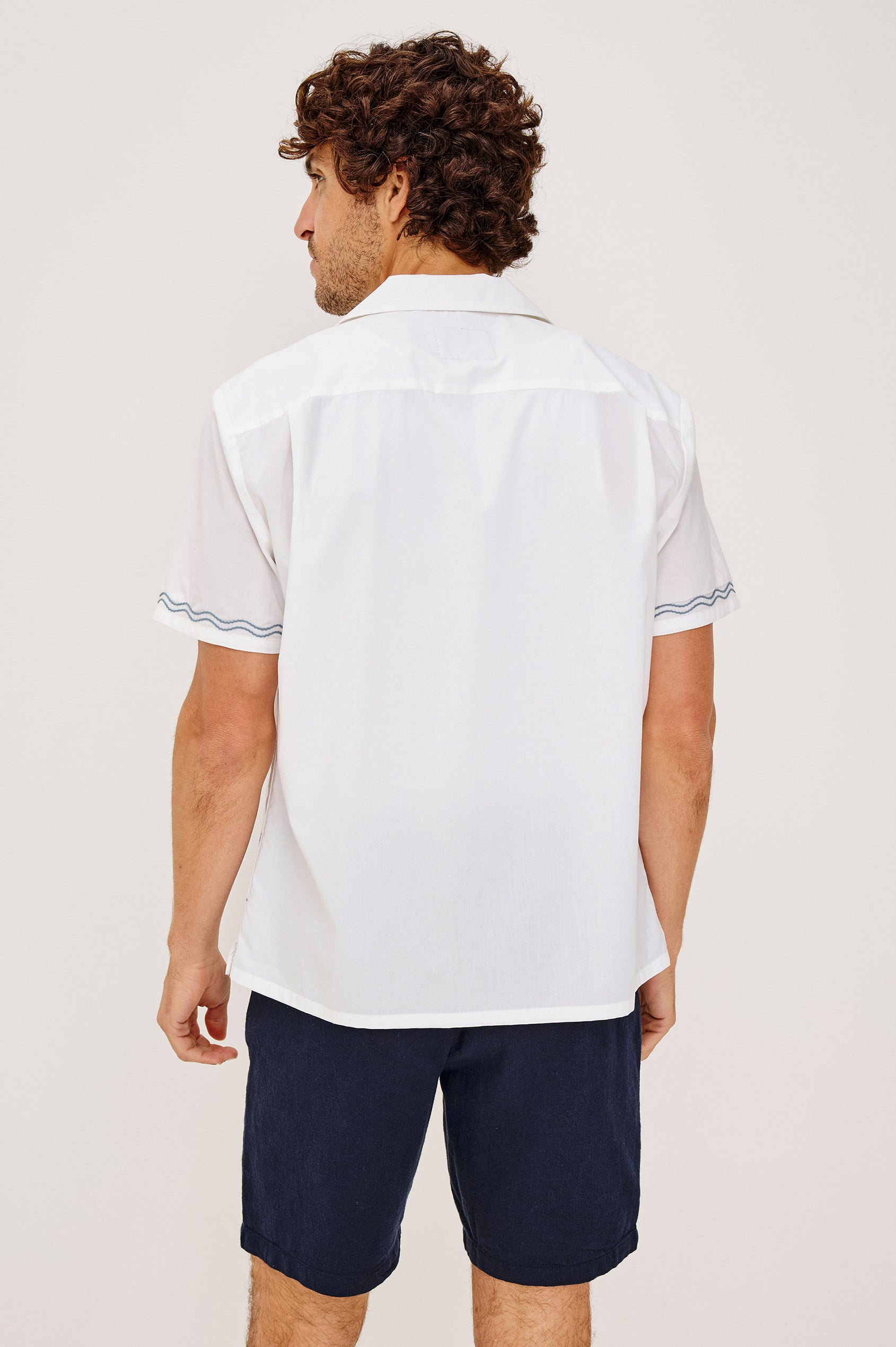 Gibson Camp Shirt in Linen-Cotton Dobby With Open Collar, Front Buttons, Short Sleeves, and Relaxed Fit in White Sail Horizon Colorway - Upper Body Back View Featured on Model