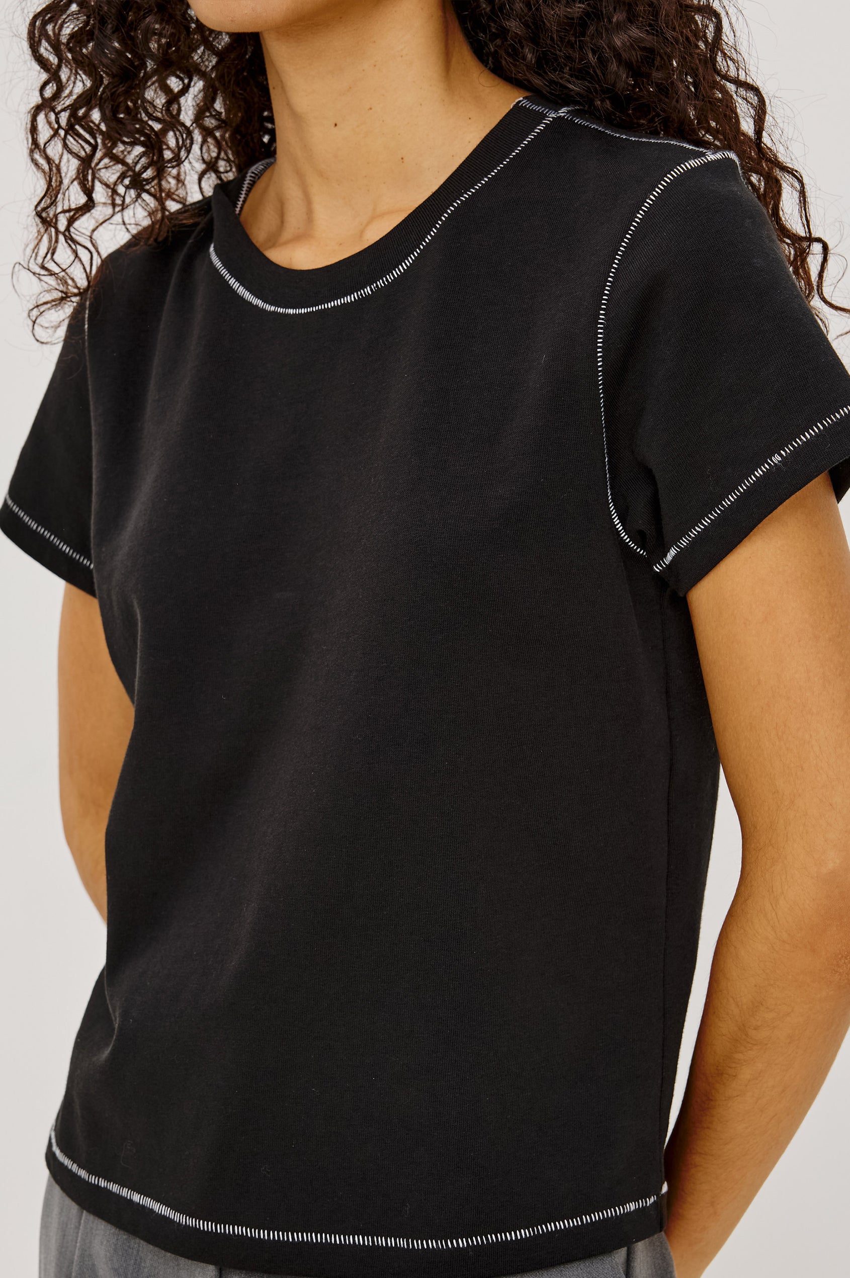 Girlfriend Pleated Jersey Tee With Crew Neckline, Short Sleeves, and Relaxed Slightly-Boxy Fit in Black Contrast Stitch Colorway - Upper Body Front View Featured on Model