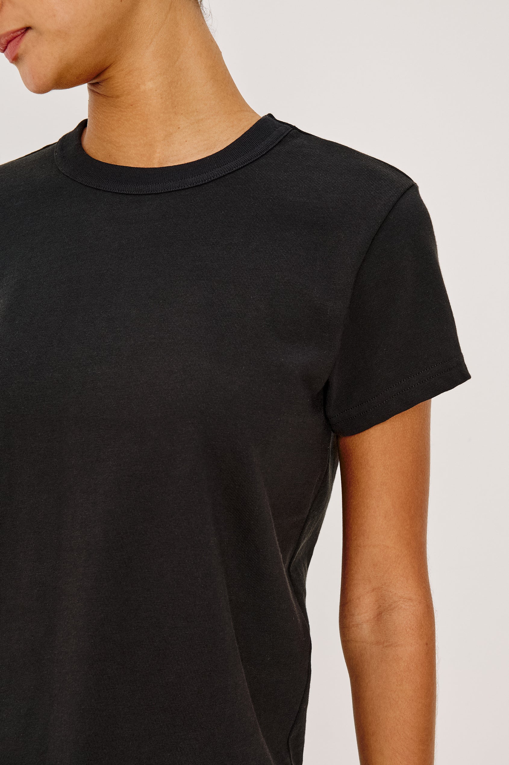 Girlfriend T-Shirt in Pleated Jersey With Slightly Boxy, Cropped Silhouette in Black Colorway - Upper Body Close Up Front View Featured on Model