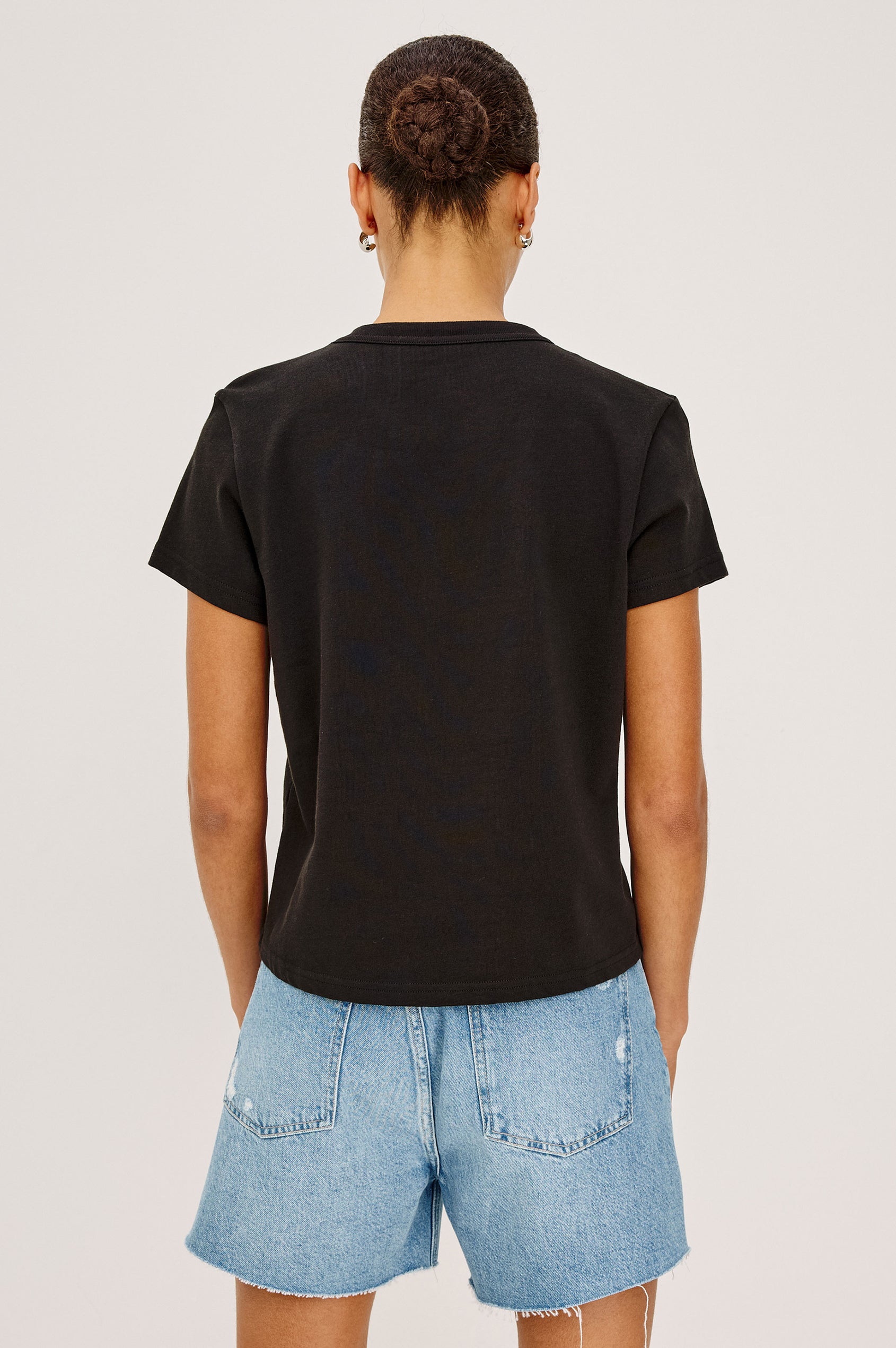 Girlfriend T-Shirt in Pleated Jersey With Slightly Boxy, Cropped Silhouette in Black Colorway - Upper Body Back View Featured on Model