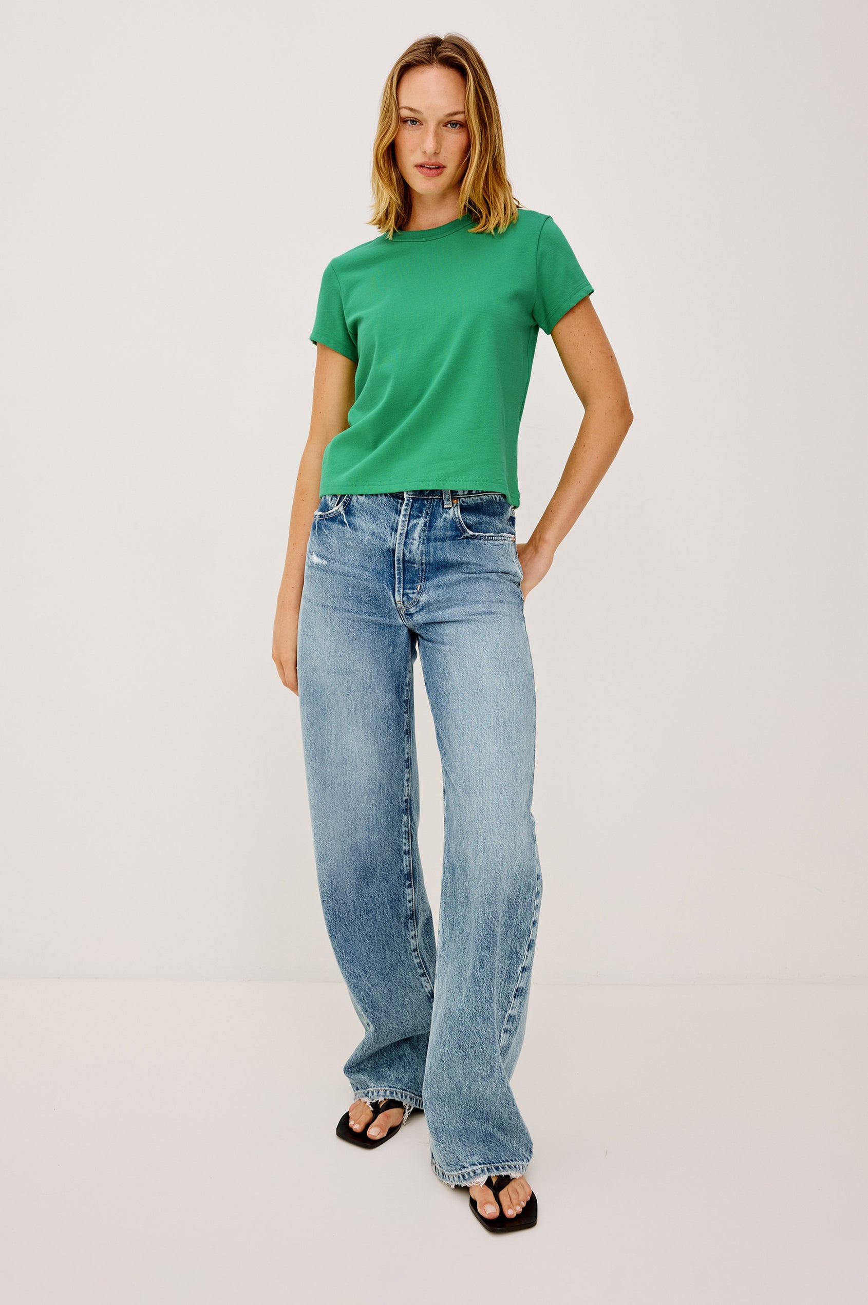 Girlfriend T-Shirt in 100% Cotton With Slightly Boxy Cropped Fit, Crew Neckline, and Short Sleeves in Clover Colorway - Full Body Front View Featured on Model