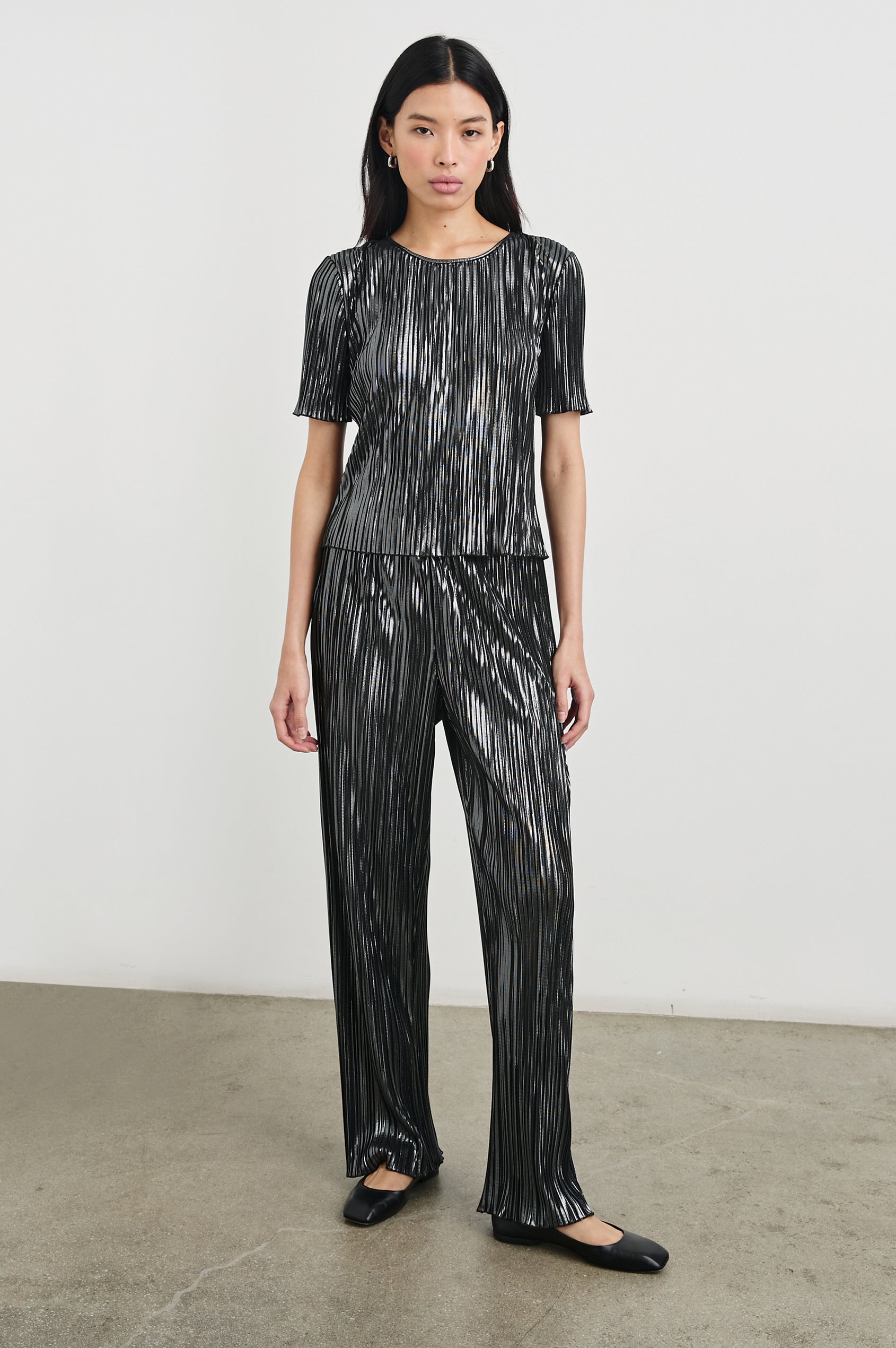 Goldie Short Sleeve Top with a Crew Neck in Gunmetal Colorway, with Thin Vertical Stripes of Back, White and Greys - Front Full Body View Featured on Model