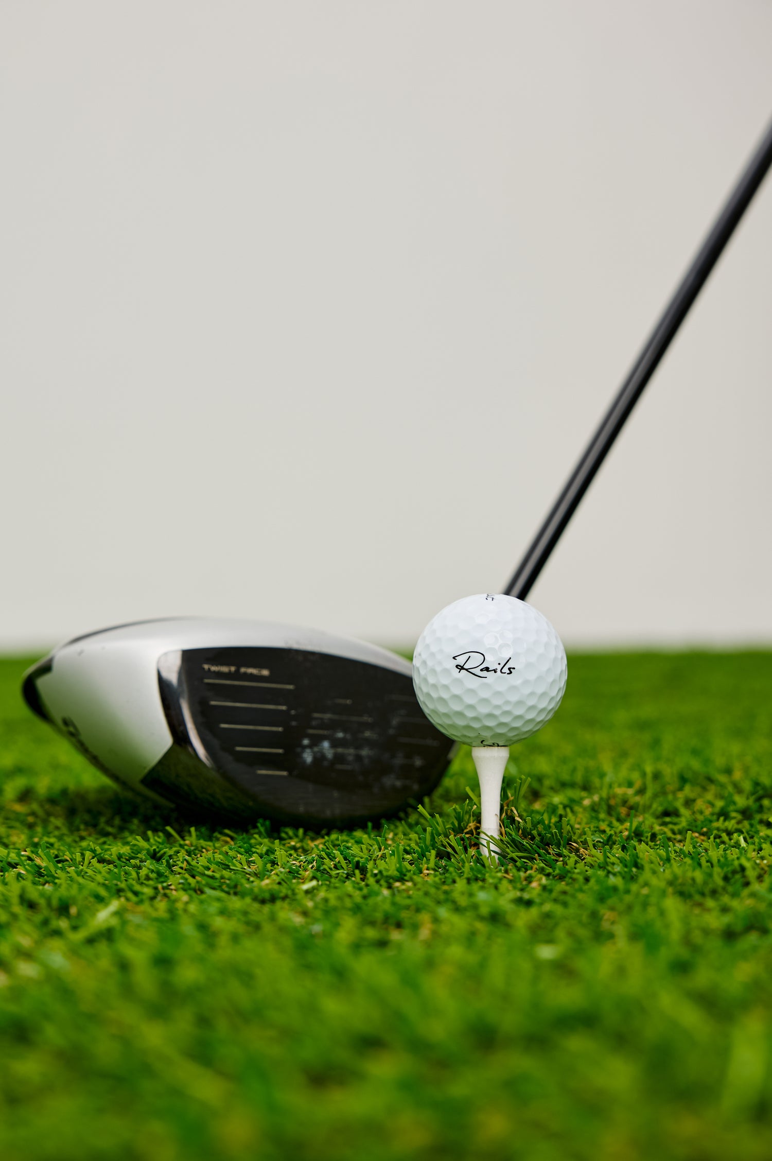 Titleist Golf Balls With Rails Branded Detail in White Colorway - Stylized Product View Featured