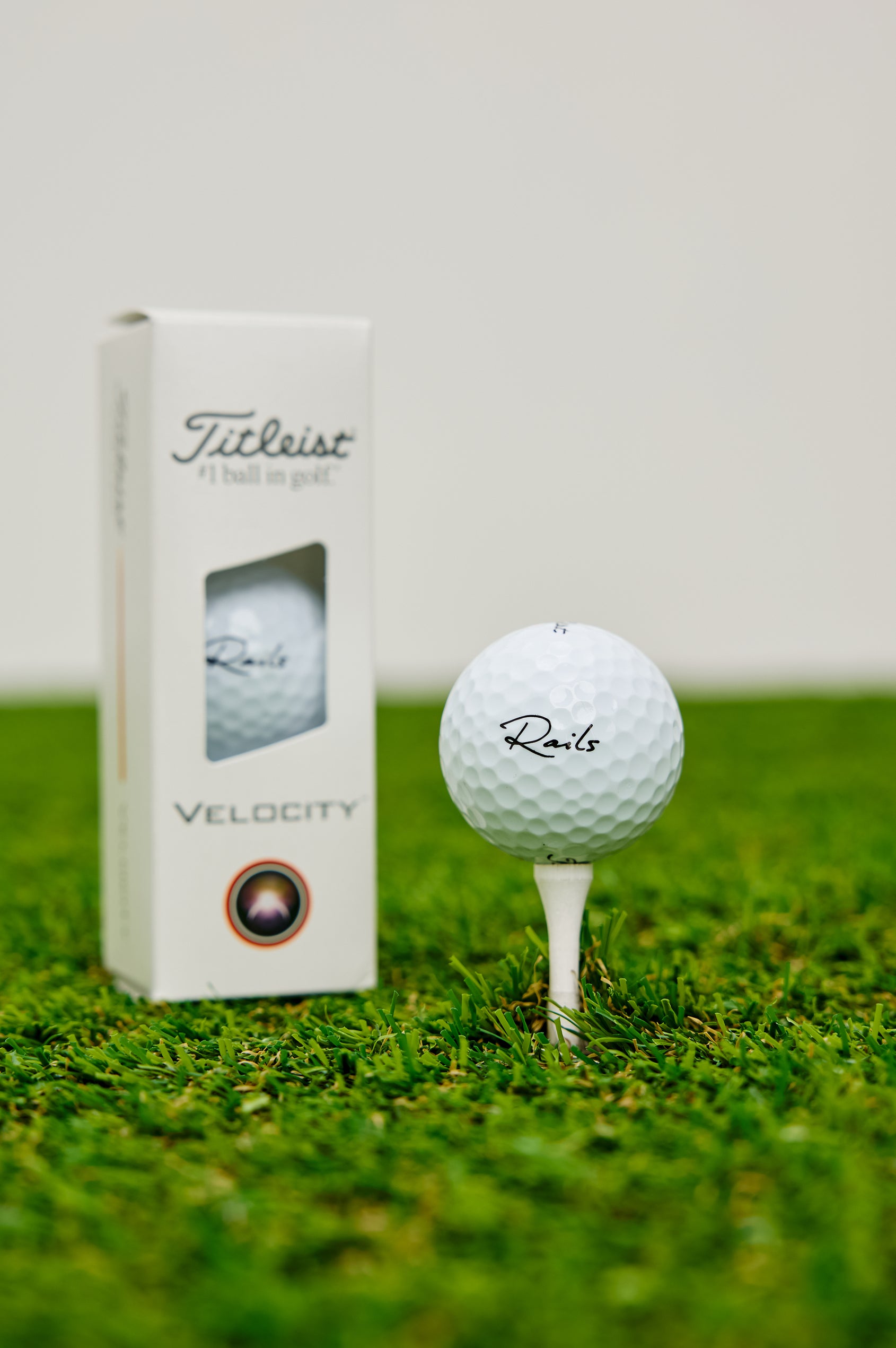 Titleist Golf Balls With Rails Branded Detail in White Colorway - Stylized Product View Featured