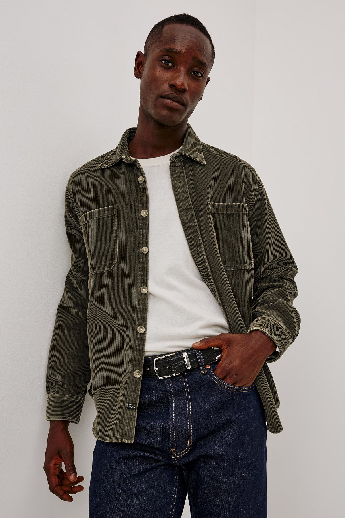 Graham Overshirt in Corduroy With Vintage Wash, Relaxed Fit, Collar, Chest Patch Pocket, and Front Buttons in Lichen Green Colorway - Upper Body Front View Featured on Model
