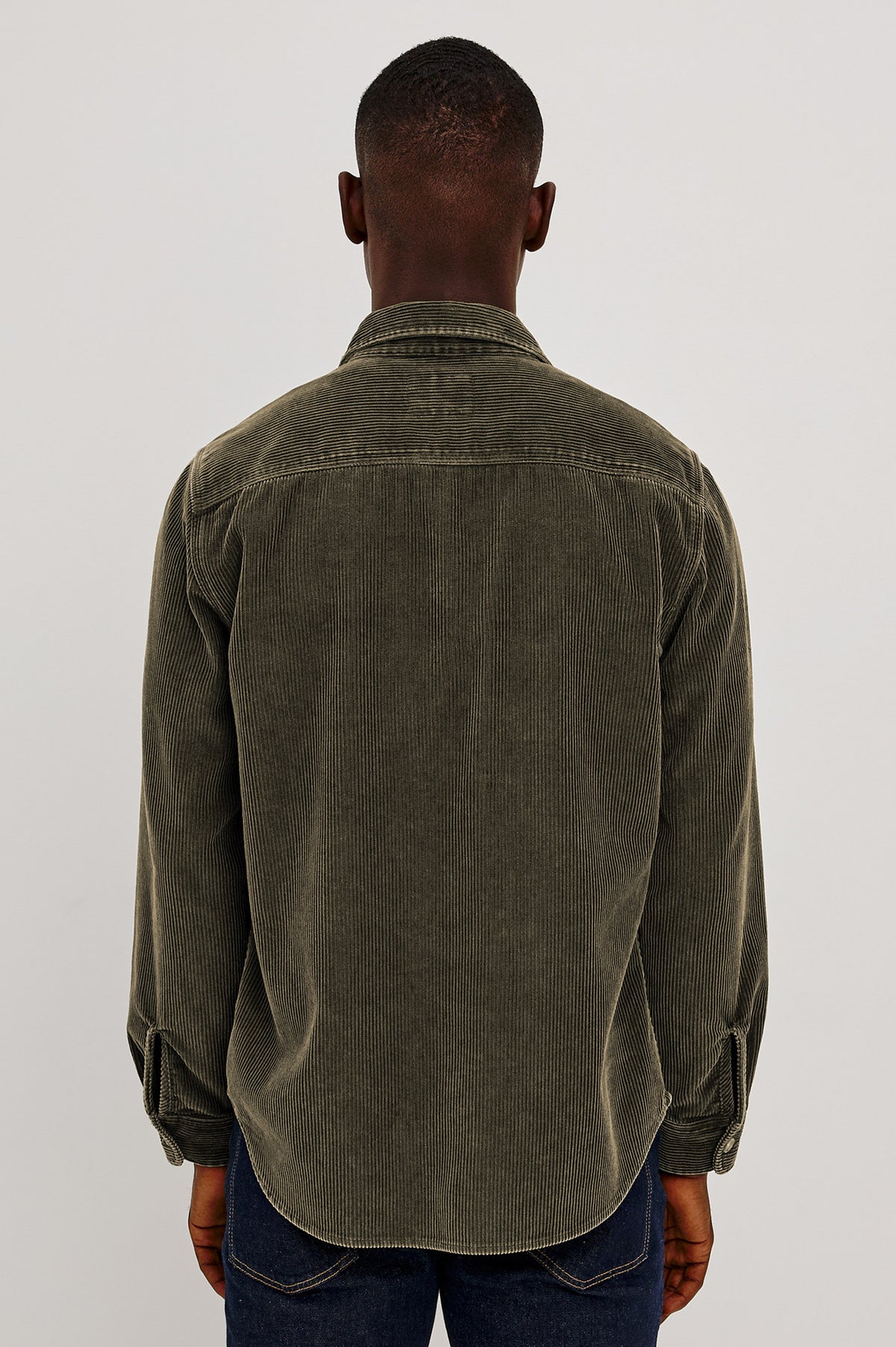 Graham Overshirt in Corduroy With Vintage Wash, Relaxed Fit, Collar, Chest Patch Pocket, and Front Buttons in Lichen Green Colorway - Upper Body Back View Featured on Model