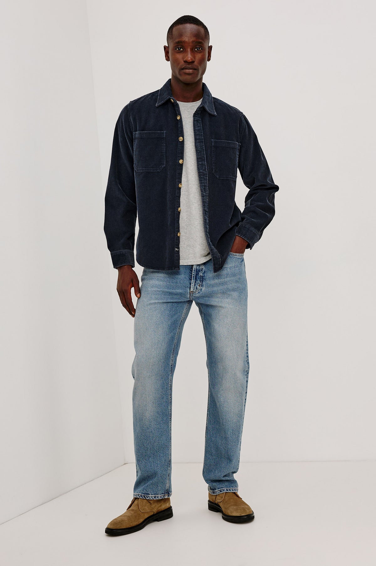 Graham Overshirt in Corduroy With Vintage Wash, Relaxed Fit, Collar, Chest Patch Pocket, and Front Buttons in Midnight Blue Colorway - Full Body Front View Featured on Model