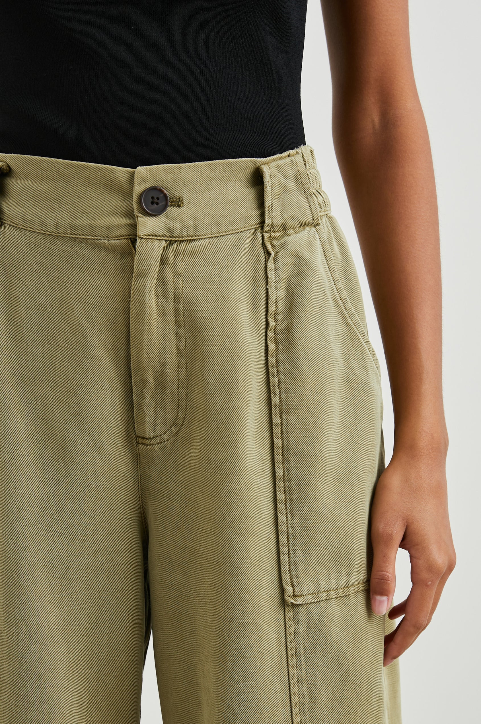 Greer Pants with Two Large Front Pockets, Two Back Welt Pockets and Vertical Seams Down the Front and Back Legs in Canteen Colorway - Front View Featured on Model 