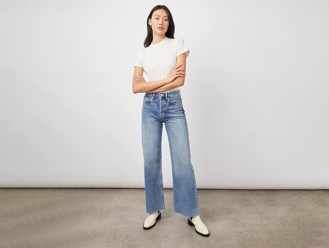 FRONT FULL BODY SHOT OF MODEL WEARING GETTY WIDE LEG JEAN WITH A WHITE T-SHIRT