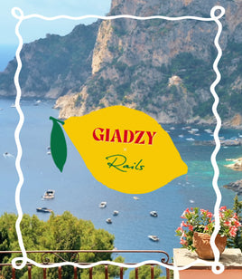 Scenic view of a coastal area with mountains and sea, featuring a yellow lemon-shaped sign with 'GIADZY' branding.