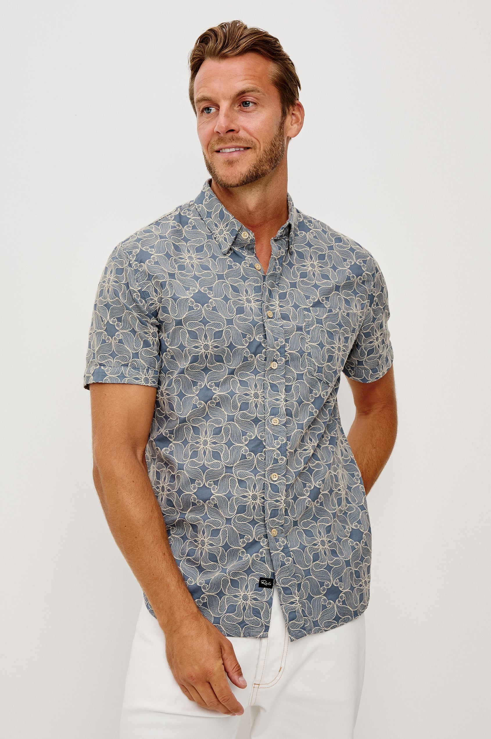 Hale Button-Up Short Sleeve Shirt in Lightweight Cotton With Contrast Jute Floral Embroidery and a Classic Fit in Daisy Steel Colorway - Upper Body Front View Featured on Model