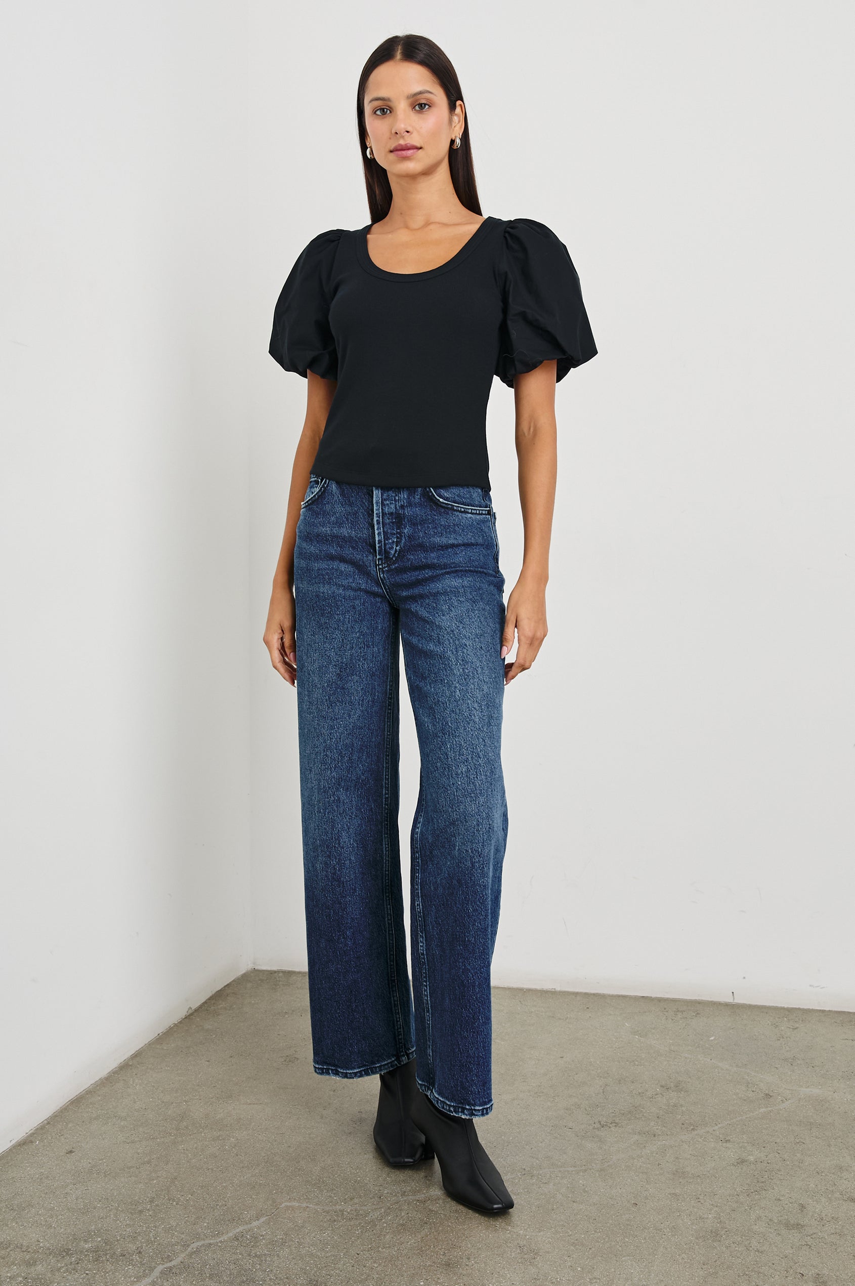 Hallie Short Sleeve Top with a Scoop Neck and Puff Sleeves in Black Colorway - Front Full Body View Featured on Model