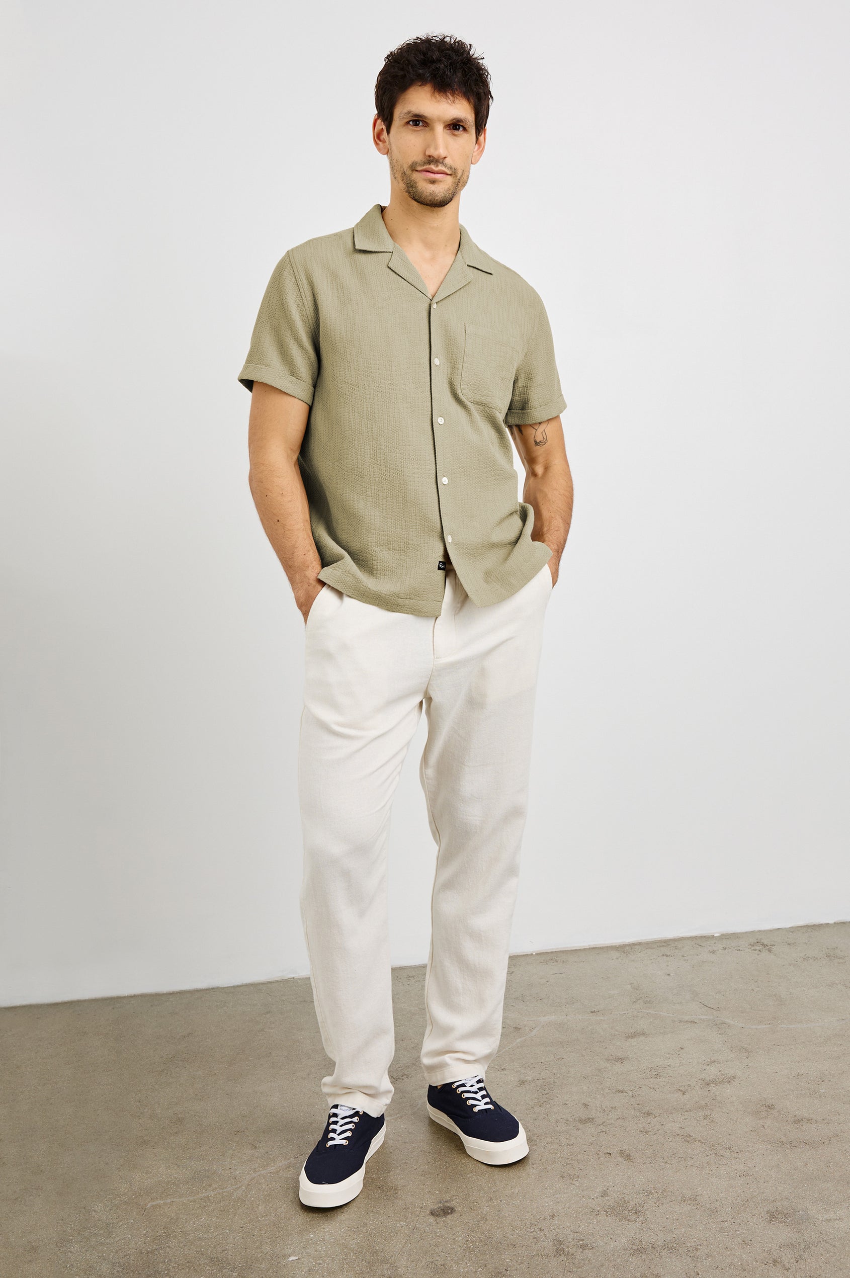 Haney Collared Button Front Shirt with Short Sleeves and a Chest Pocket in Kelp Colorway. Front View Shown on Model.