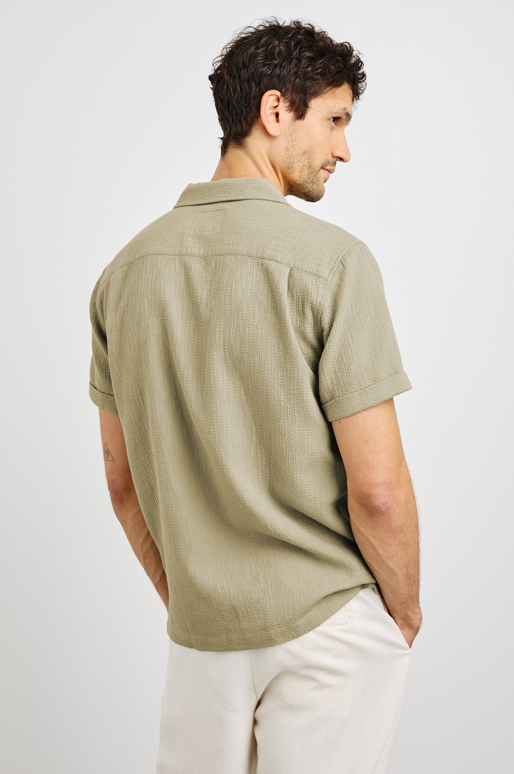 Haney Collared Button Front Shirt with Short Sleeves and a Chest Pocket in Kelp Colorway. Back View Shown on Model.
