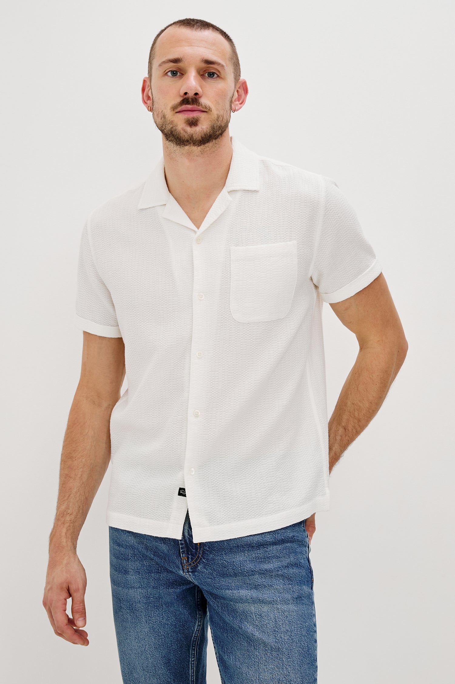 Haney Collared Button Front Shirt with Short Sleeves and a Chest Pocket in White Colorway. Front View Shown on Model.