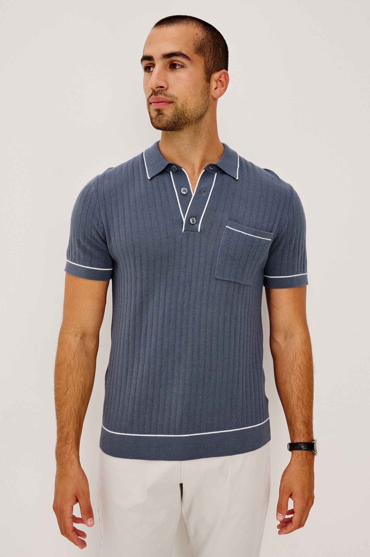 Hardy Polo Shirt in Luxe Cotton Rib Knit With Collar, Half Button Placket, Short Sleeves, and Contrast Trim in Faded Navy Colorway - Upper Body Front View Featured on Model