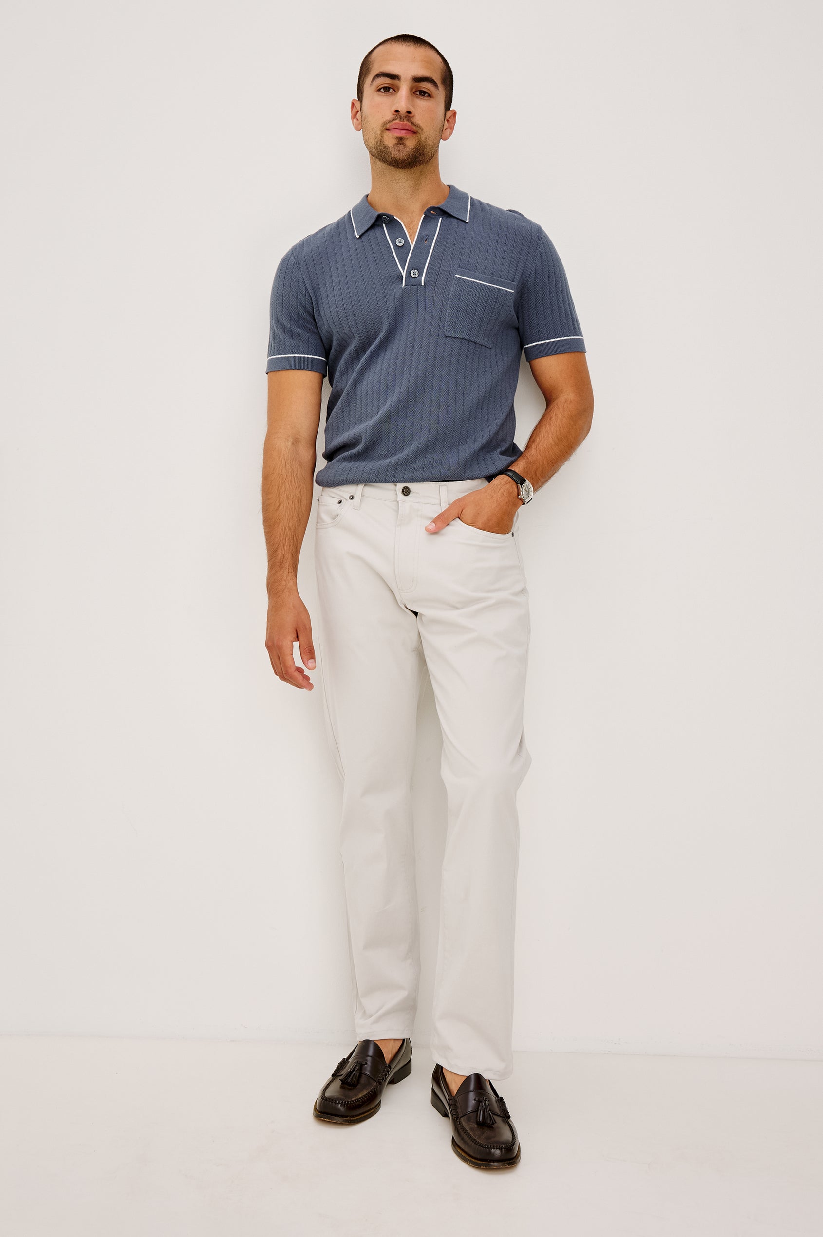 Hardy Polo Shirt in Luxe Cotton Rib Knit With Collar, Half Button Placket, Short Sleeves, and Contrast Trim in Faded Navy Colorway - Full Body Front View Featured on Model
